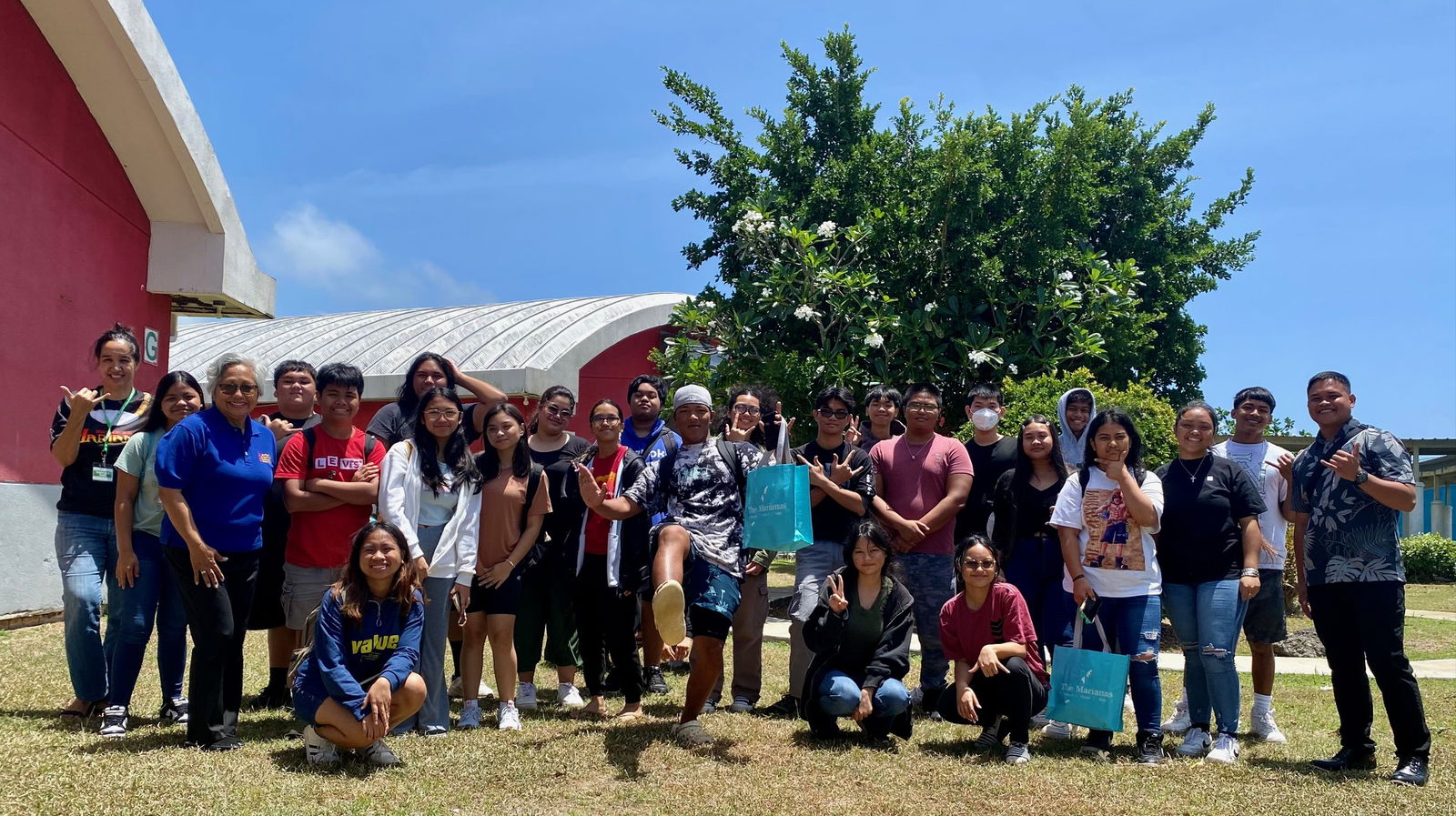 Members of the Hospitality & Tourism Class of Saipan Southern High School pose for a photo with representatives of the Marianas Tourism Education Council and the Marianas Visitors Authority following an educational outreach on April 11, 2024, at the school in Koblerville, Saipan.