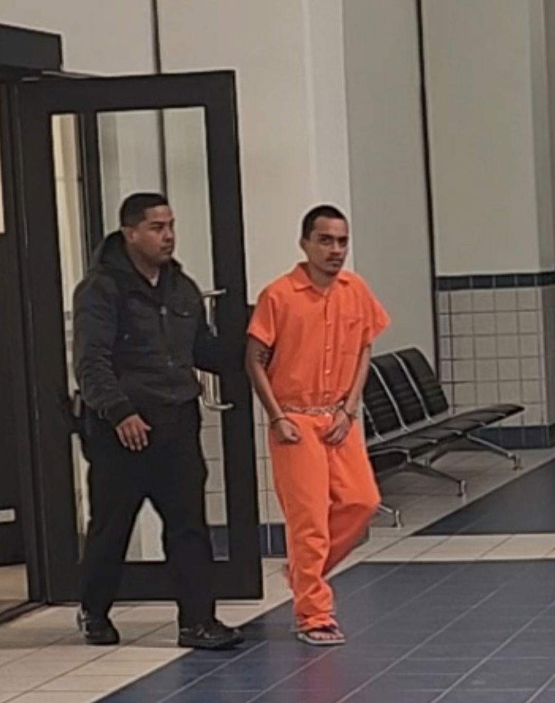 Hitler Weilbacher is escorted by a Corrections officer at the local courthouse on Monday.