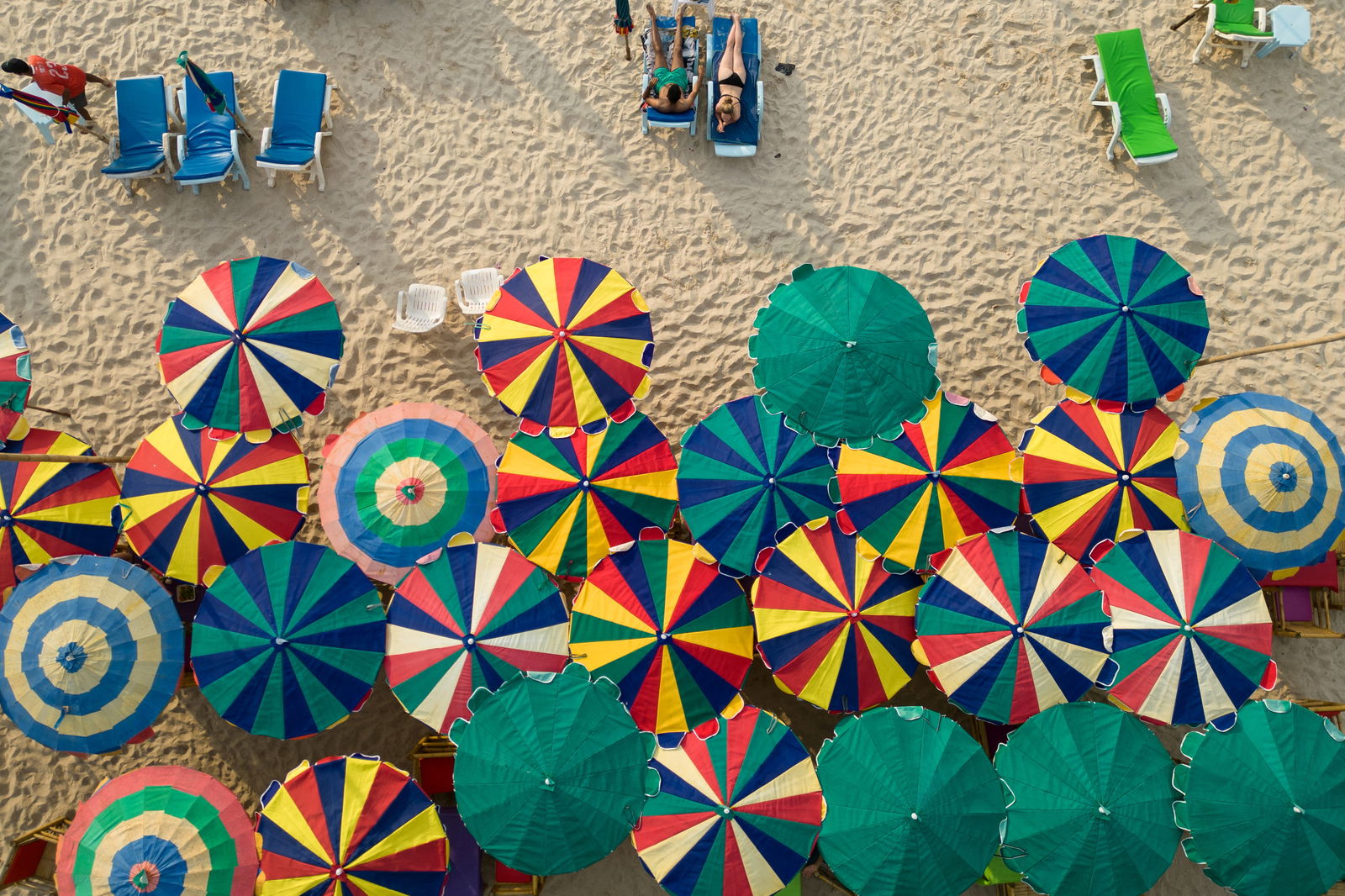 Colourful umbrellas are seen in a restaurant as tourists enjoy a beach in the island of Phuket in Thailand January 19, 2023. 