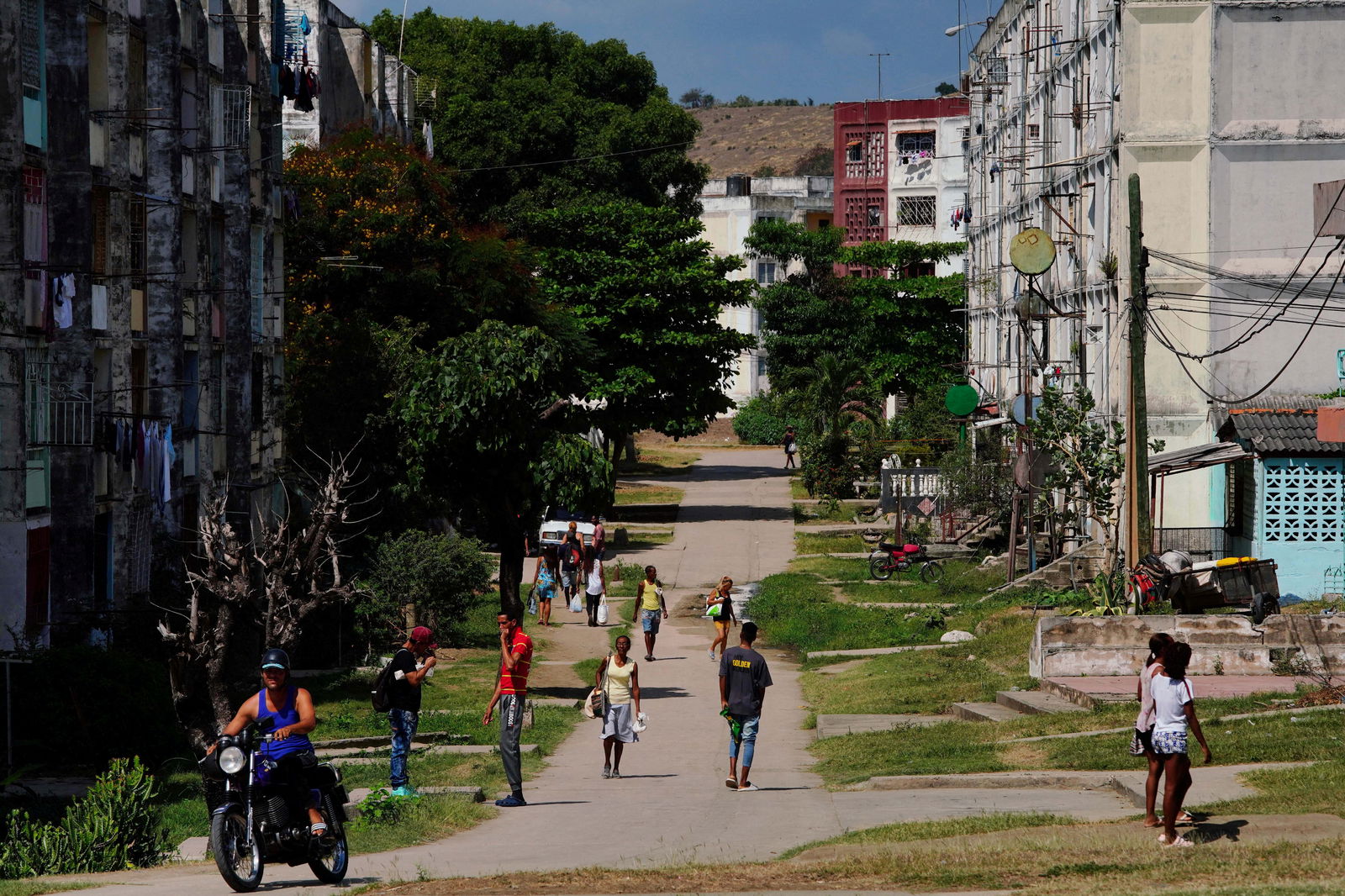 FILE PHOTO: People walk on a street in Santiago, Cuba, March 21, 2024. 