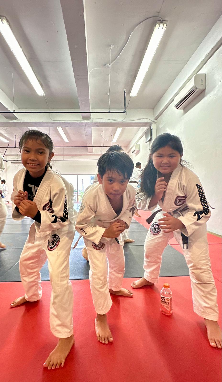 Aiyani Rios, Deighton Muna and Jacqueline Quitugua pose for a photo. They are three of the seven members of the NMI's Trench Tech Purebred team that will be compete in the 2024 Patgon Jiu Jitsu Tournament  on April 27 at the UOG Calvo Field House in Mangilao, Guam.