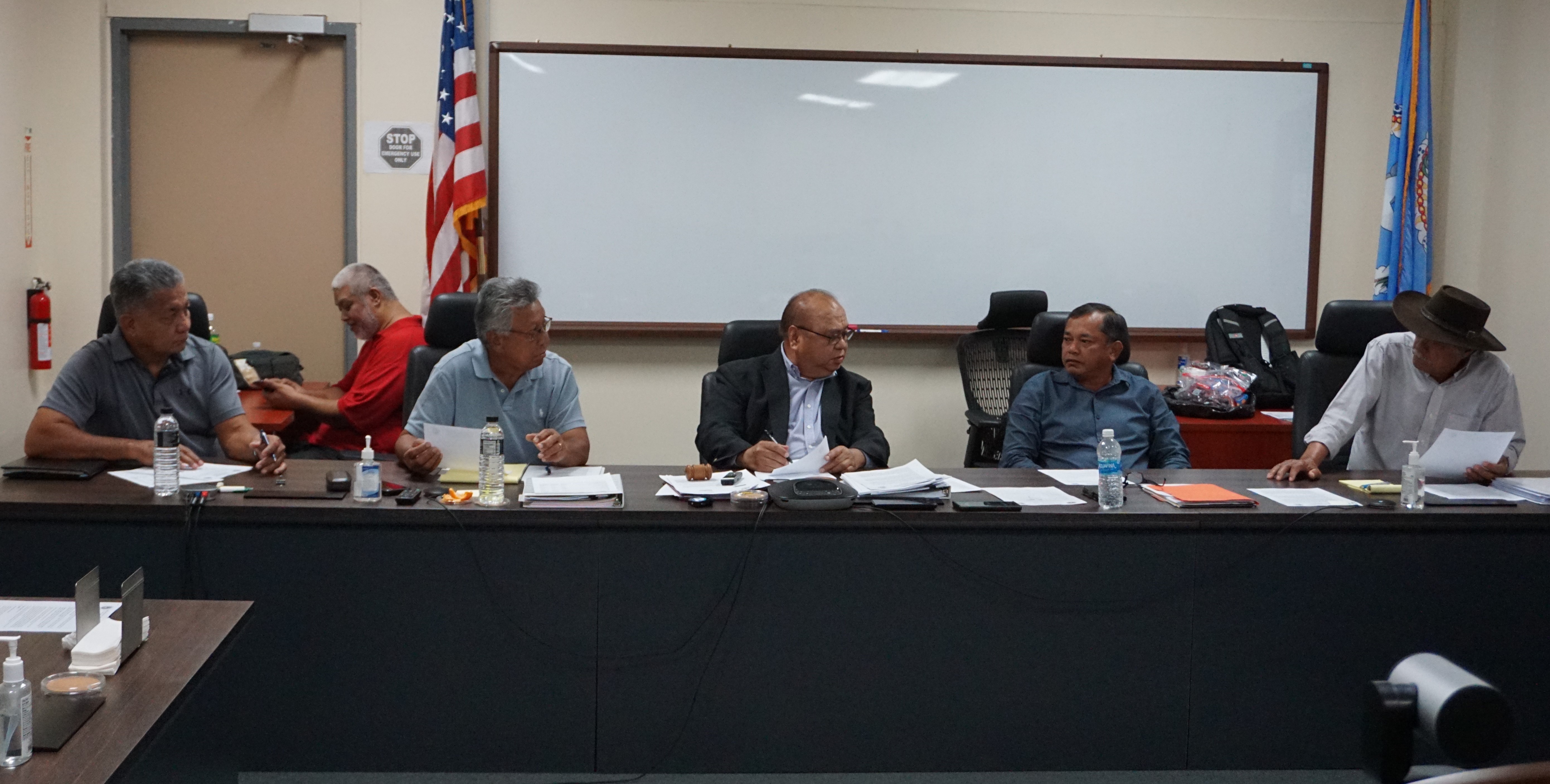 Commonwealth Casino Commissioners Martin Mendiola, left, and Ramon M. Dela Cruz, right, with Commission Chairman Edward C. Deleon Guerrero, center, Commissioner Mario Taitano, third left, and Vice Chairman Ralph S. Demapan, second right, during their monthly meeting on Thursday in the commission's conference room in Gualo Rai.