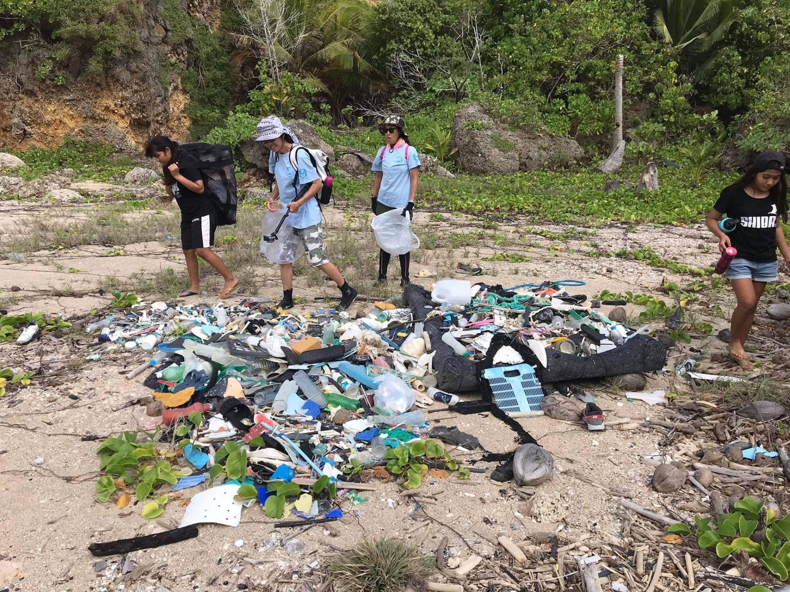 Volunteers at last year’s Save the Old Man cleanup gather marine debris at the beach. This year’s event will take place on April 13 and 14.