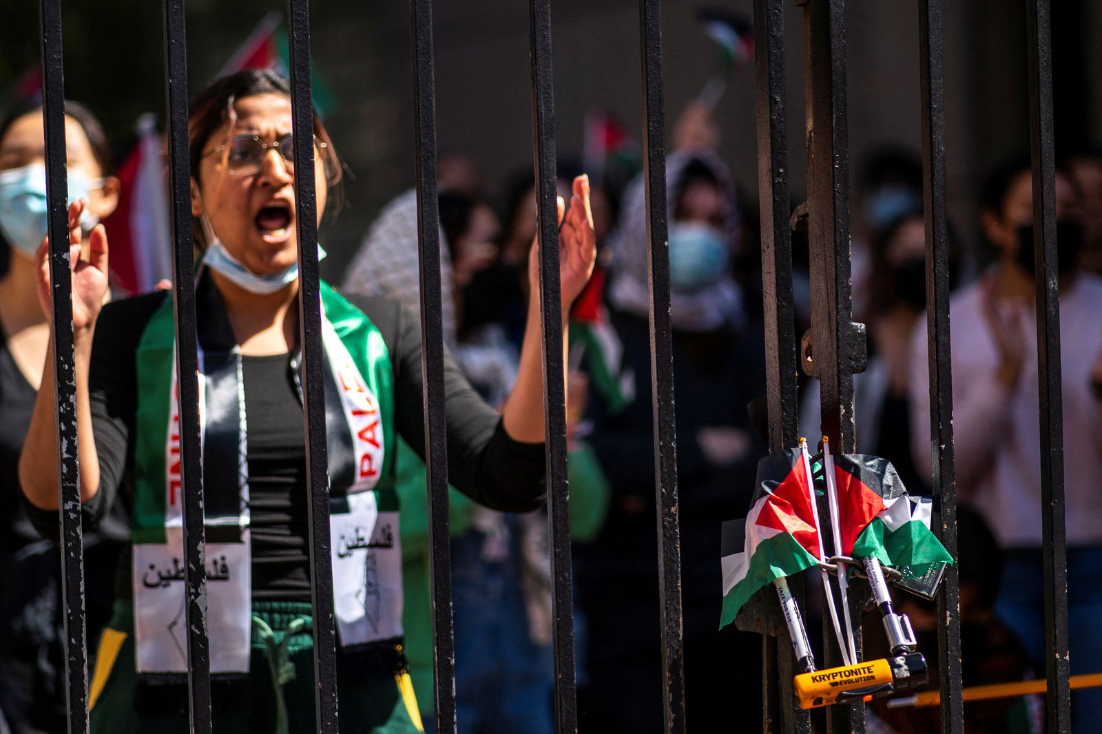 Palestinian flags are placed on a locked fence while students demonstrate outside Columbia University campus, as protests continue inside and outside the university during the ongoing conflict between Israel and the Palestinian Islamist group Hamas, in New York City, U.S., April 22, 2024. 