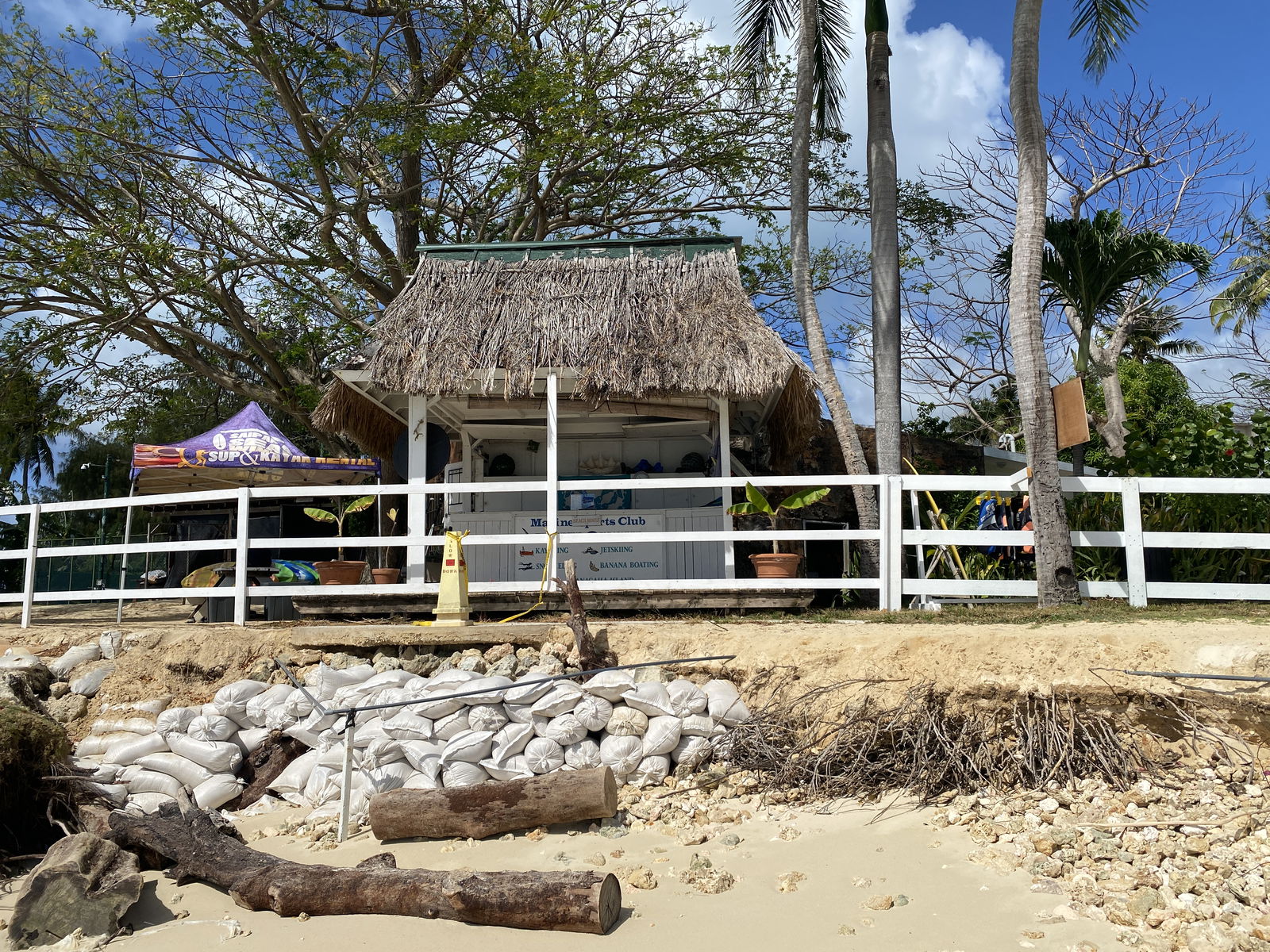 Sand bags in the foreground were placed at the beach in order to prevent Marine Sports Club from facing further shore erosion​.