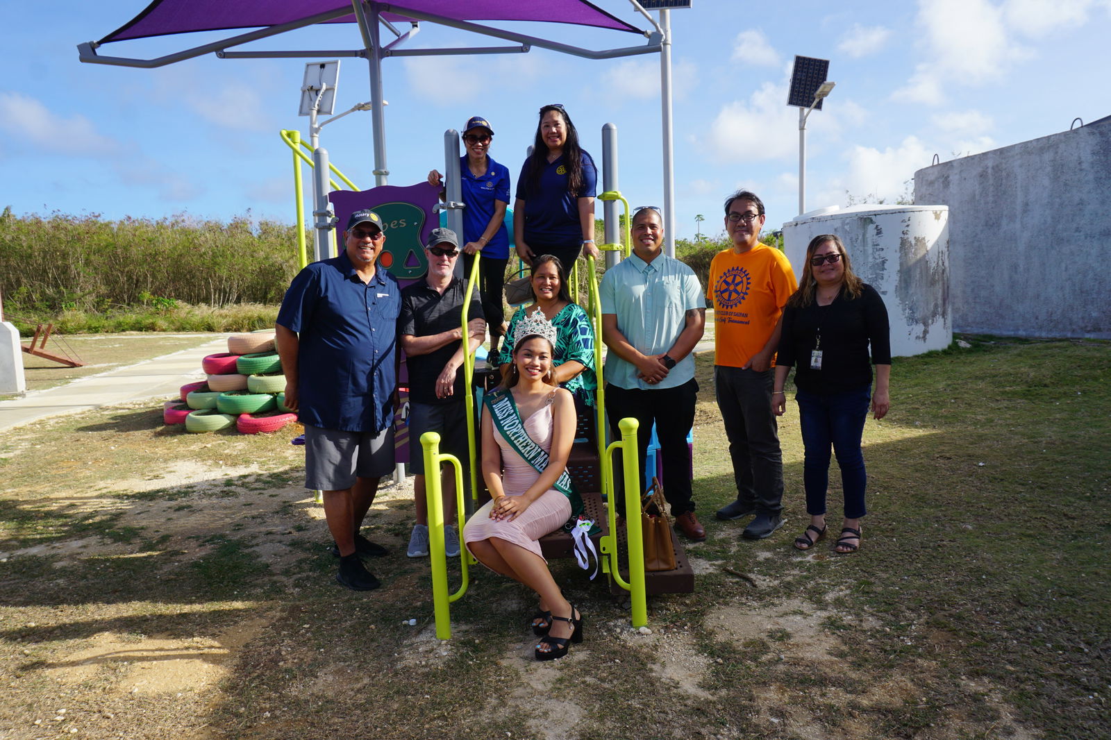 The Rotary Club of Saipan​ helped make the playground a reality. Their members posed for a photo alongside Miss Northern Marianas Earth 2023 Jan Cruz.