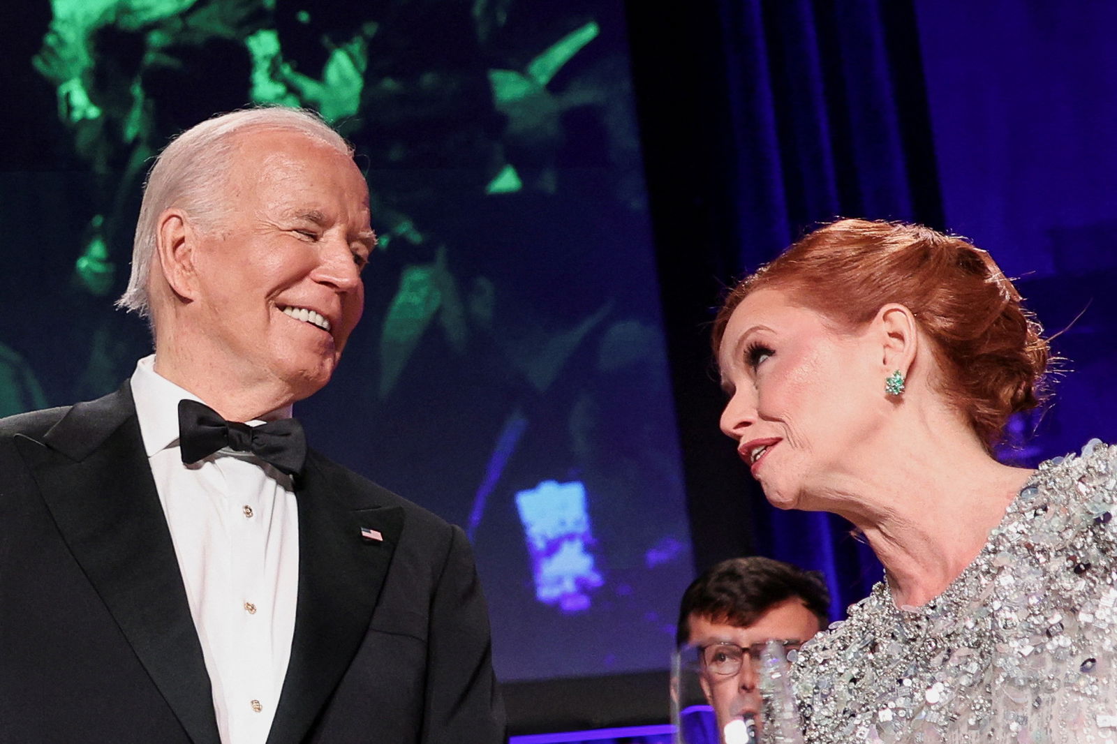 President Joe Biden speaks with Kelly O'Donnell as they attend the White House Correspondents' Association Dinner in Washington, D.C., April 27, 2024.