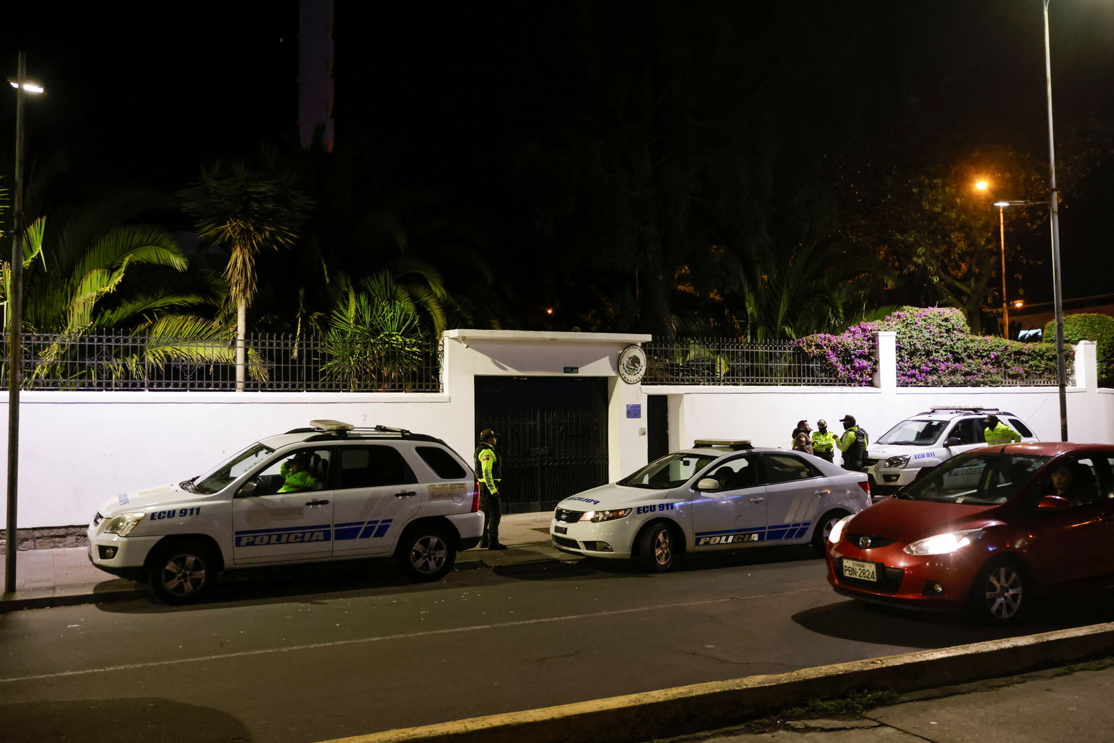 Police and military officials keep guard outside the Mexican embassy from where they forcibly removed the former Ecuador Vice President Jorge Glas in Quito, Ecuador April 5, 2024. 