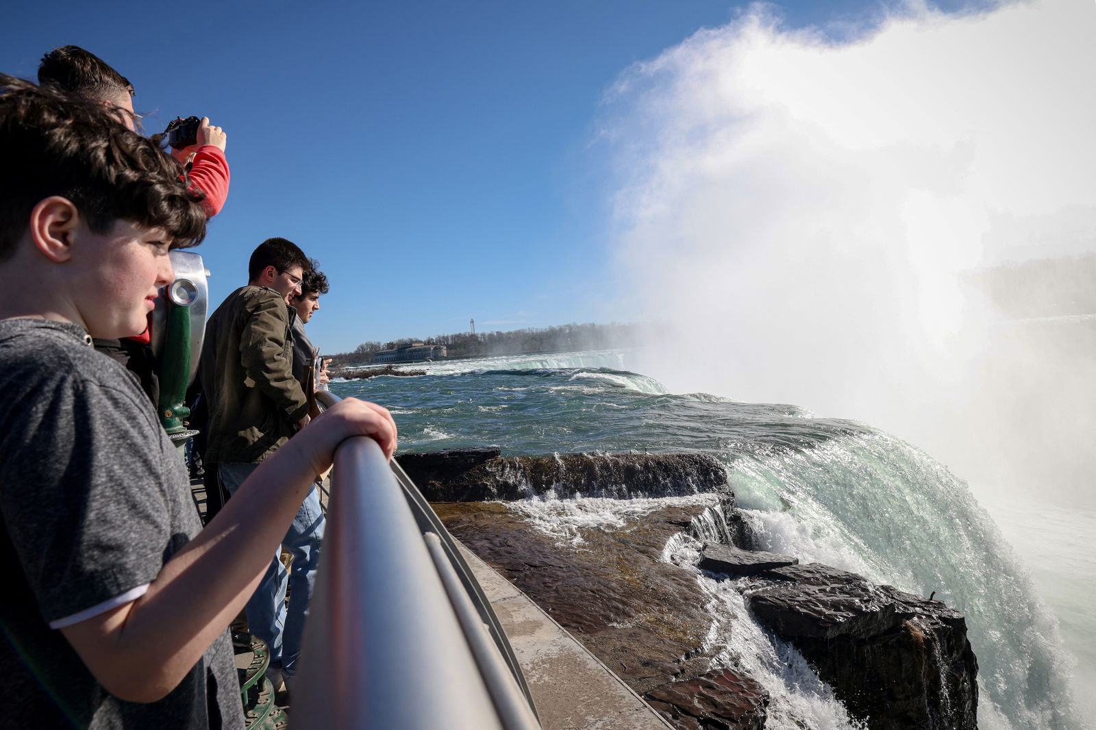 Tourists look at the Horseshoe Falls, ahead of the Solar Eclipse that will take place across parts of the United States and Canada on April 8, at Niagara Falls, New York, U.S., April 7, 2024. 