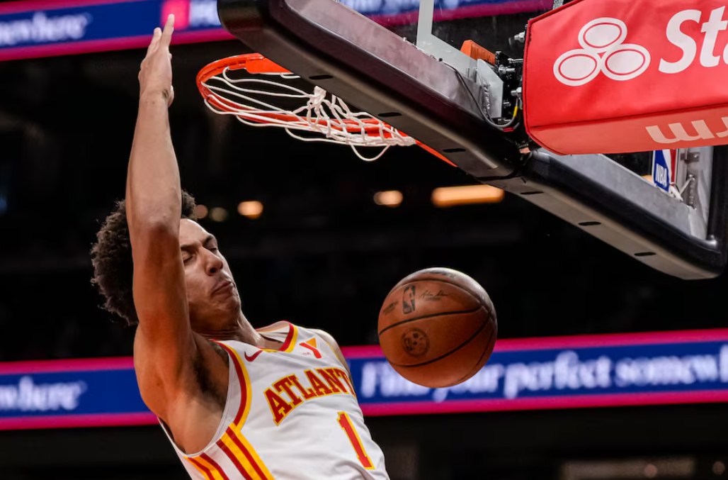 Atlanta Hawks forward Jalen Johnson (1) dunks the ball against the Detroit Pistons during the first half at State Farm Arena in Atlanta, Georgia, April 3, 2024.
