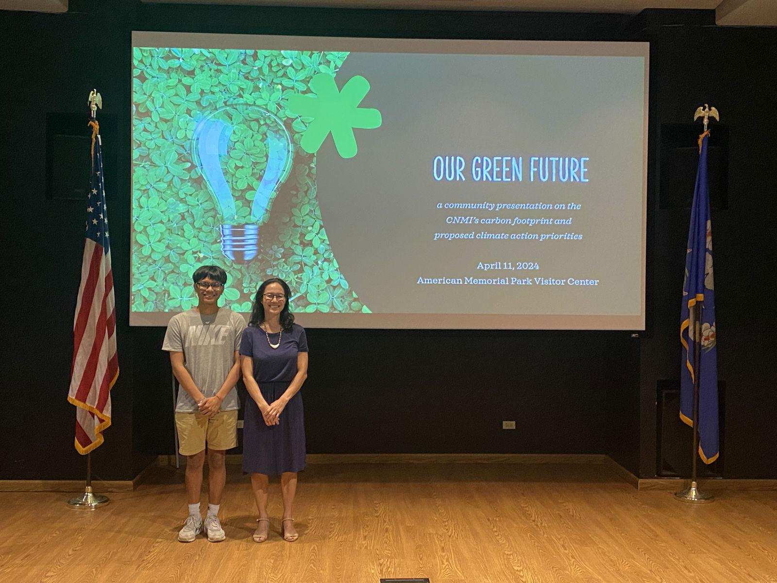 Tina Sablan, right, stands with Northern Marianas College student Jude Litulumar, who assisted her with her presentation at the American Memorial Park Visitor Center on April 11, 2024.