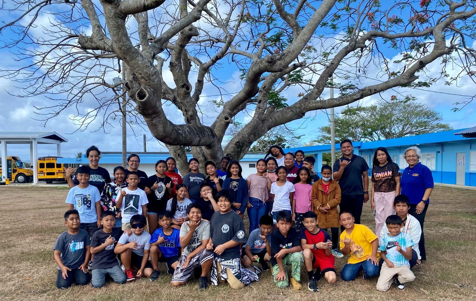 Fourth graders of Tinian Elementary School with representatives of the Marianas Visitors Authority and the Marianas Tourism Education Council following an educational outreach at the school in Tinian on April 24, 2024.