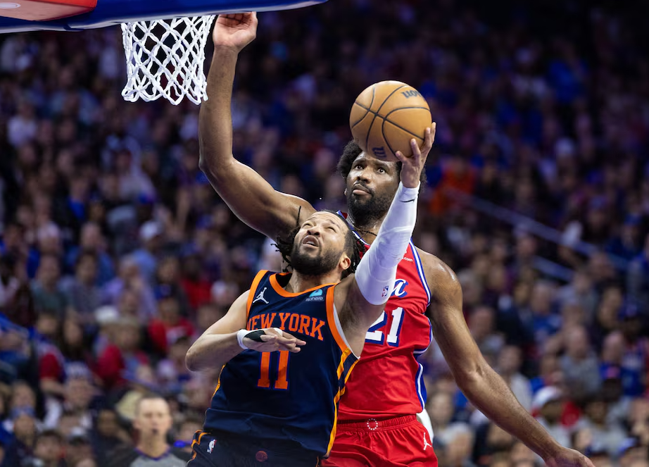 New York Knicks guard Jalen Brunson (11) drives against Philadelphia 76ers center Joel Embiid (21) during the second half of game four of the first round in the 2024 NBA playoffs at Wells Fargo Center in Philadelphia, Pennsylvania, April 28, 2024.