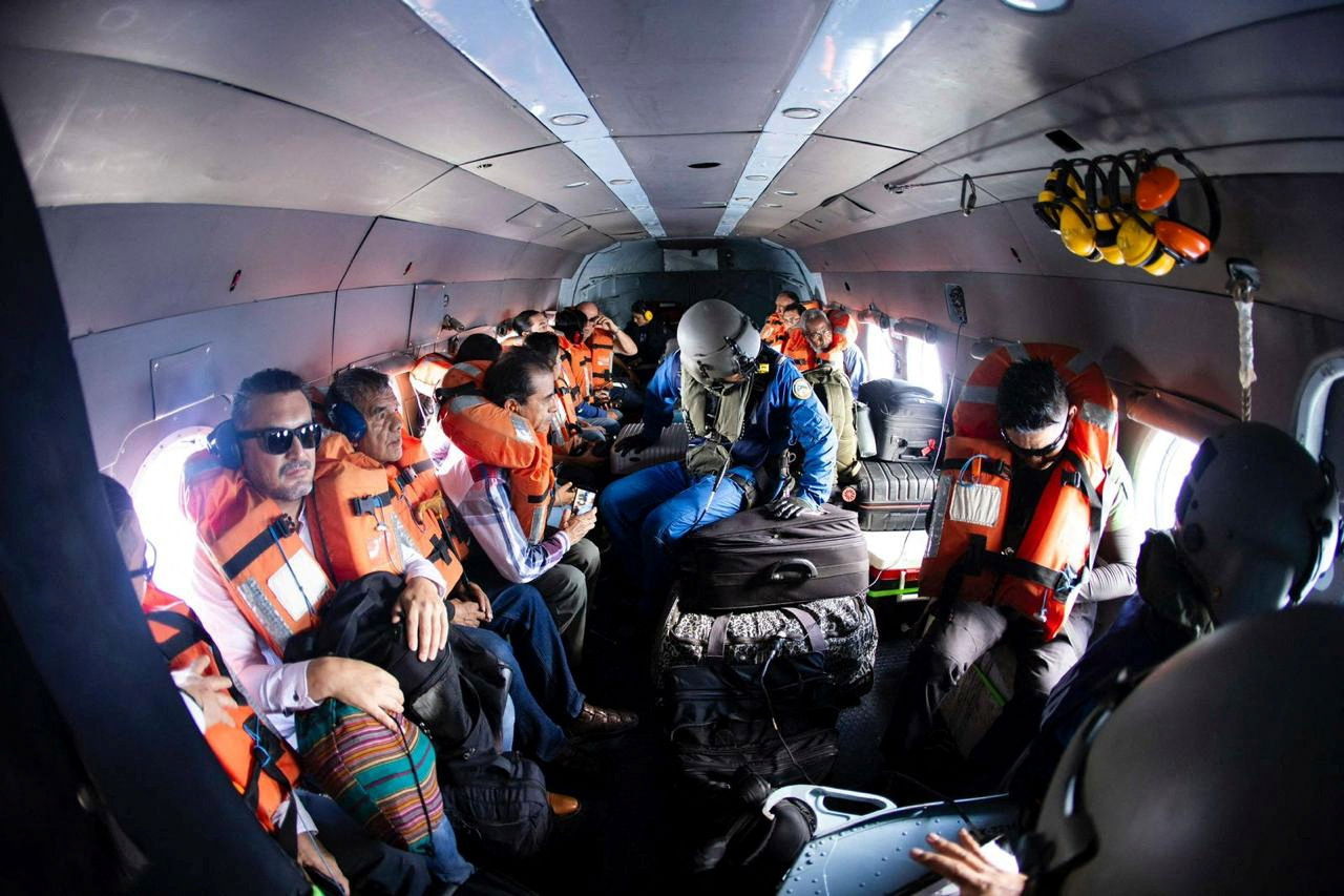 Mexican citizens are evacuated in a helicopter from Haiti by personnel of the Mexican Navy, in Port-au-Prince, Haiti, in this photo distributed to Reuters on April 1, 2024. 