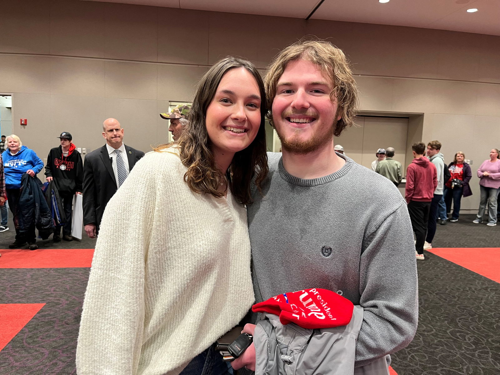 Caitlyn Huenink, 20, and Collin Crego, 19, both students at the University of Wisconsin-Green Bay, pose for a picture at a Donald Trump rally in Green Bay, Wisconsin, April 2, 2024.
