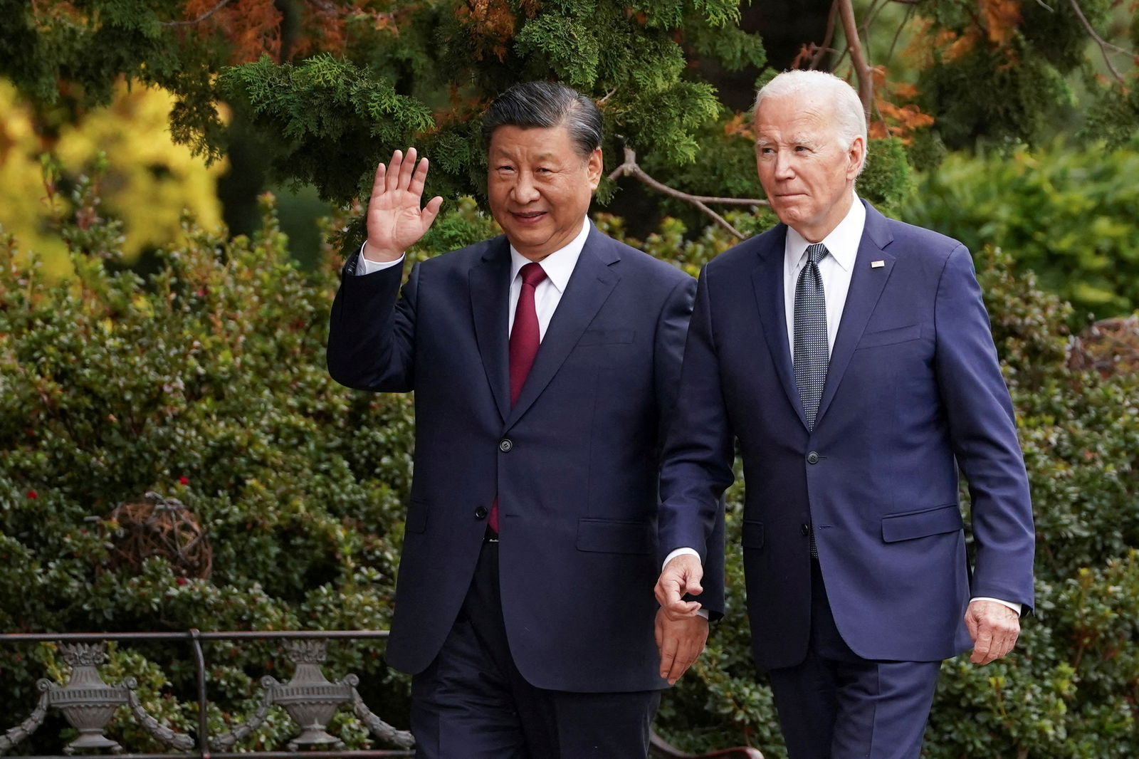 FILE PHOTO: Chinese President Xi Jinping waves as he walks with U.S. President Joe Biden at Filoli estate on the sidelines of the Asia-Pacific Economic Cooperation (APEC) summit, in Woodside, California, U.S., November 15, 2023. 