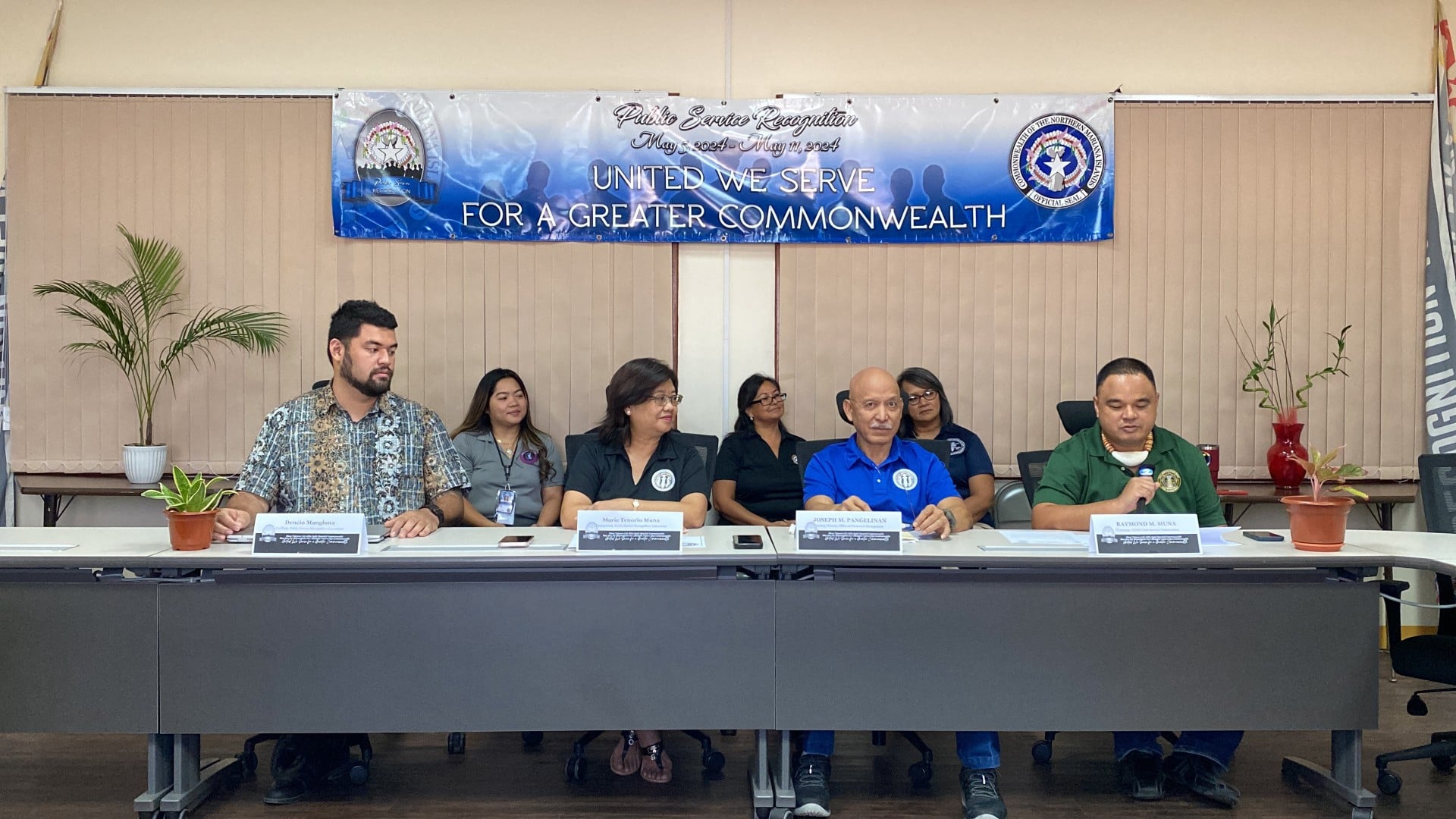 From left, front row, Dencio Manglona, Marie Muna, Joseph Pangelinan and Ray Muna hold a press conference at the Office of Personnel Management in Gualo Rai on Tuesday.