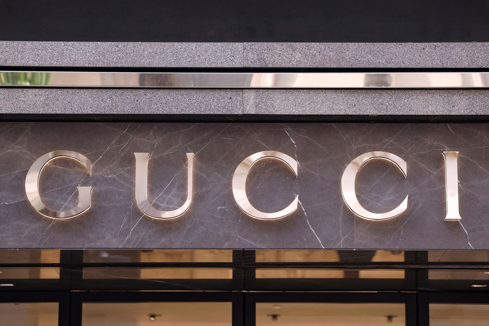 The logo of fashion house Gucci is seen outside a shop in Milan, Italy, April 8, 2024. 