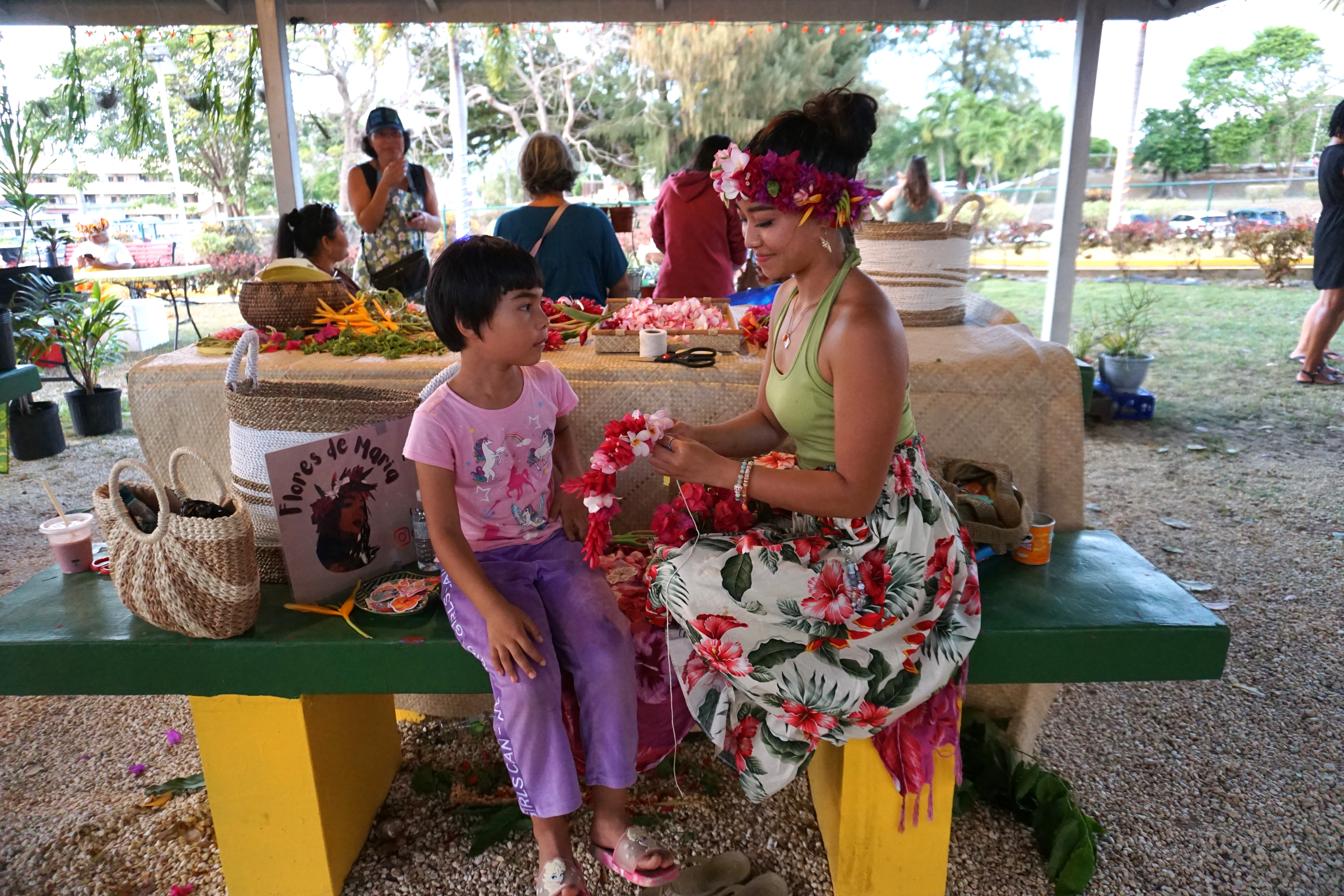 Mary Sablan creates floral art for Suna Kurtoglu. ​