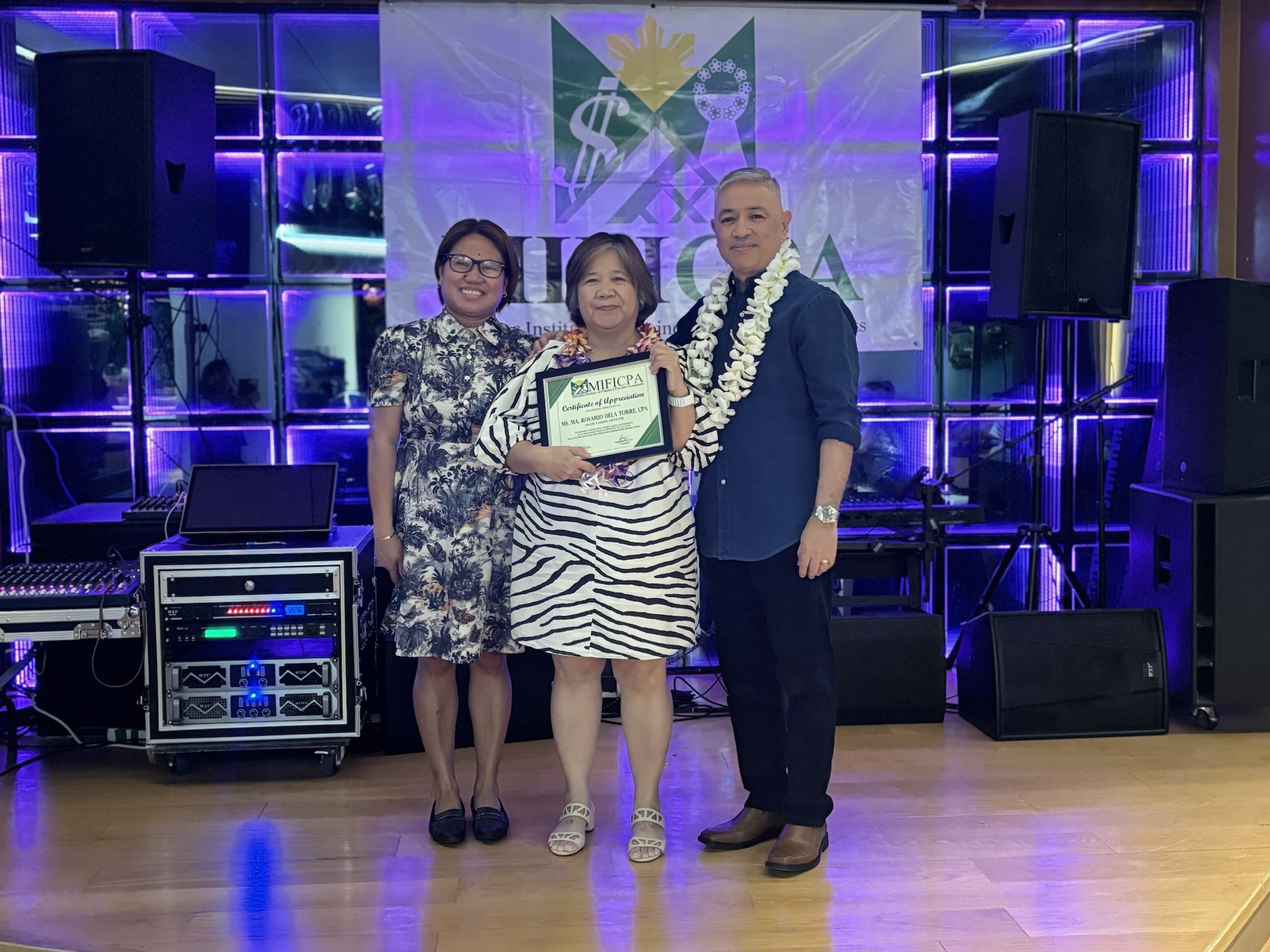 From left, Maria Cely Monteclaro, Marianas Institute of Filipino Certified Public Accountants internal vice president; Maria Dela Torre, MJ Visions Inc. president; and Valentino Cruz, MIFICPA president, pose for a photo.