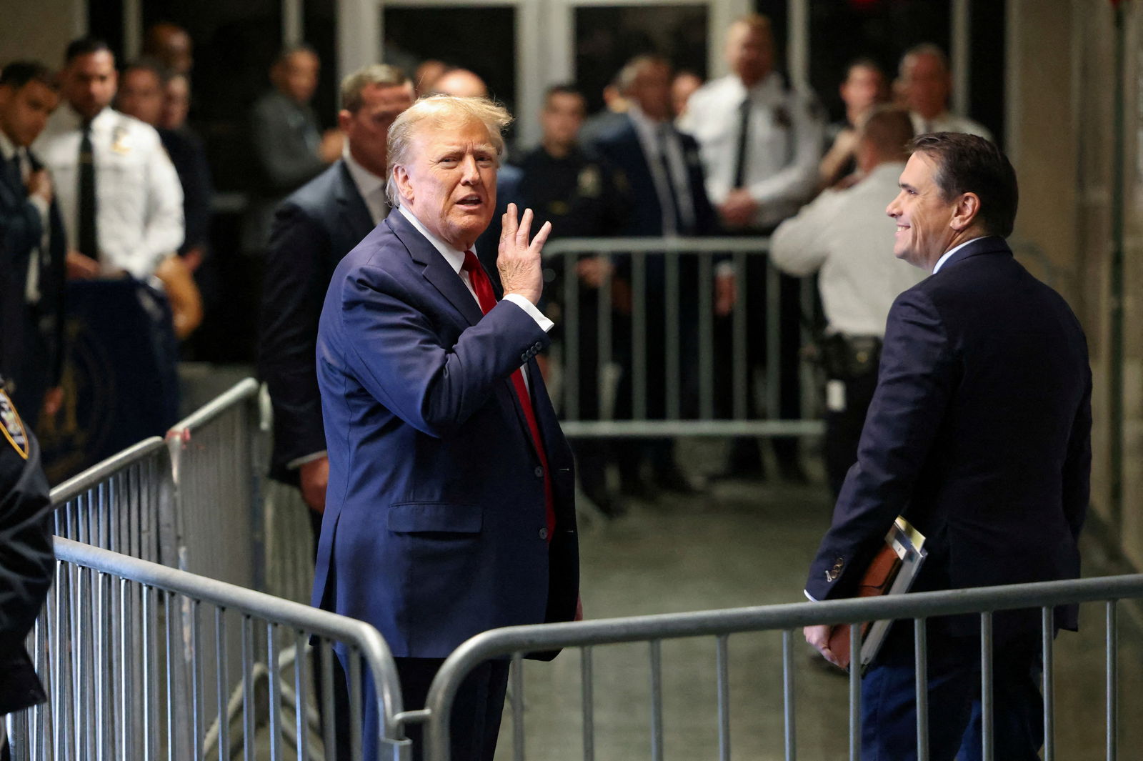 FILE PHOTO: Former U.S. President Donald Trump gestures outside the courtroom on the day of a court hearing on charges of falsifying business records to cover up a hush money payment to a porn star before the 2016 election, in New York State Supreme Court in the Manhattan borough of New York City, U.S., February 15, 2024. 