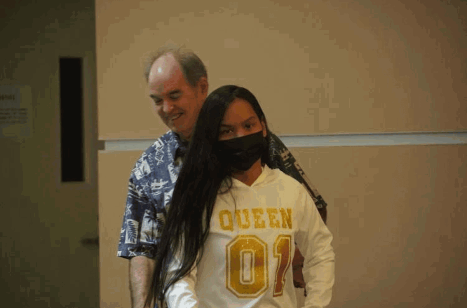 Giltinan Ramangmou, front, is seen walking out of a court hearing with her attorney, William Bischoff, on Friday, Feb. 23, 2024, at the Superior Court of Guam in Hagåtña. 