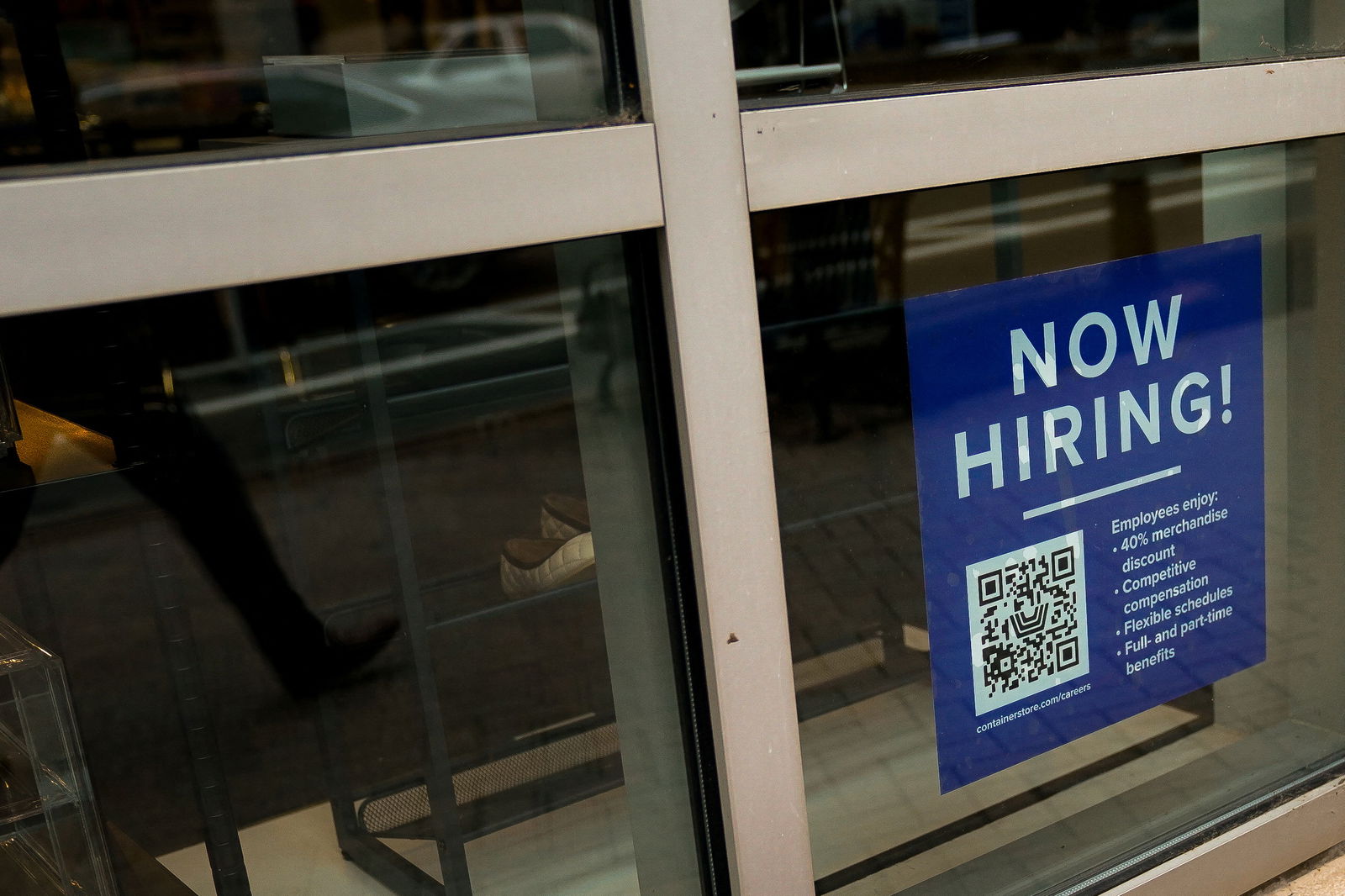 FILE PHOTO: An employee hiring sign with a QR code is seen in a window of a business in Arlington, Virginia, U.S., April 7, 2023. 