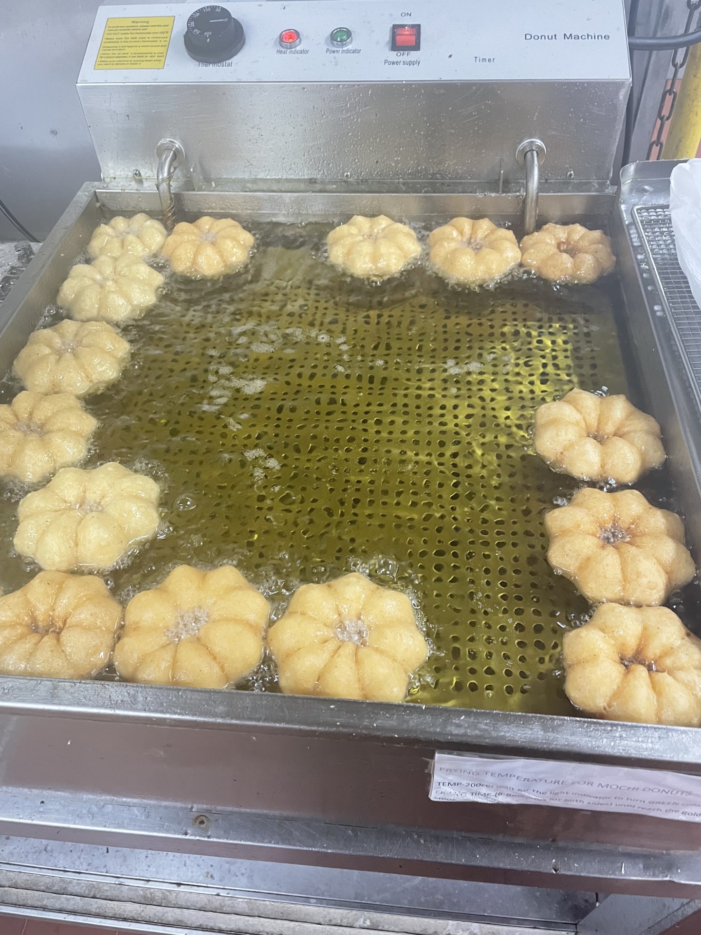 Zyrhone Gapor’s specialty is frying mochi donuts. They sell out quickly, he says.