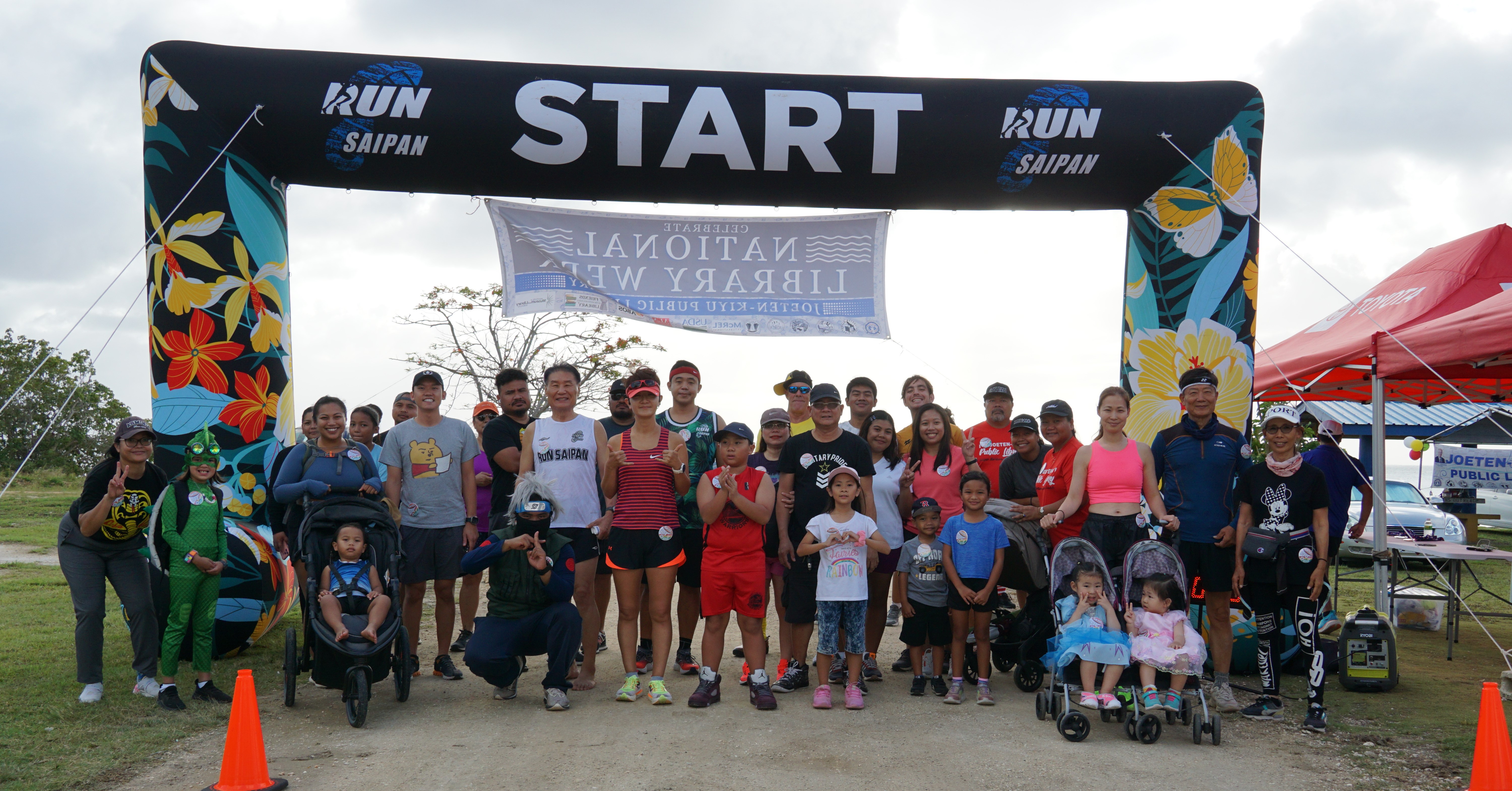 Participants of the 3rd Annual Friends of the Joeten-Kiyu Public Library 5K Fun Run/Walk pose for a photo before the start of the race at the Garapan Fishing Base on Saturday.