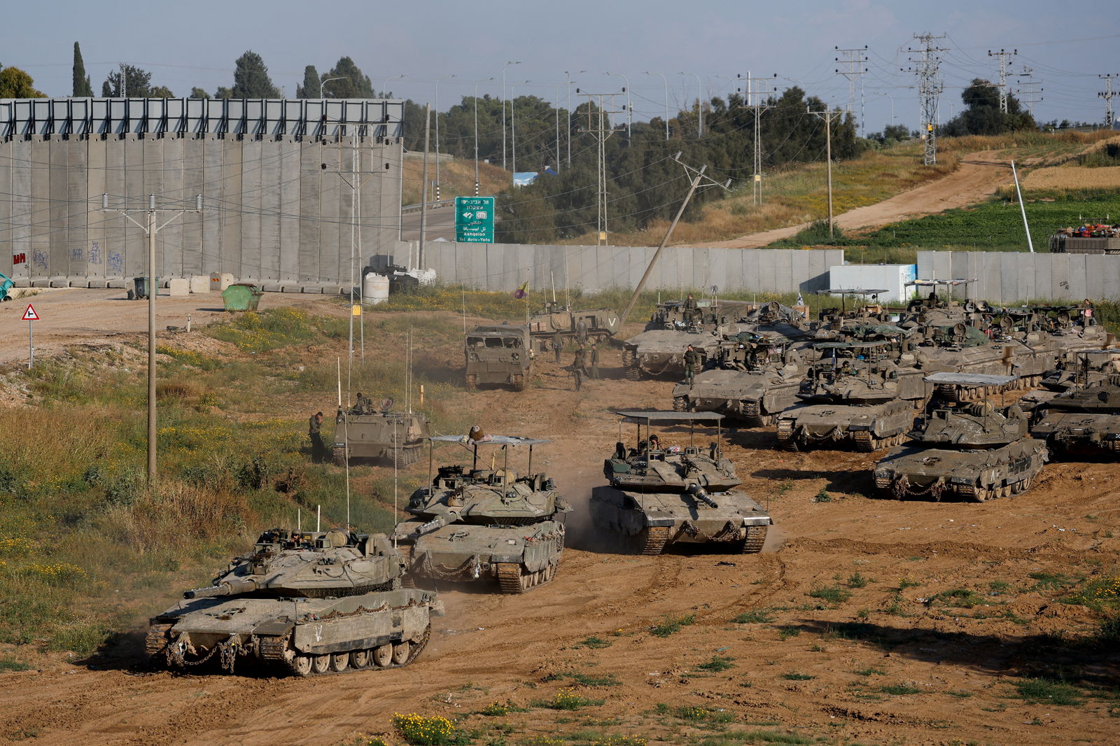 FILE PHOTO: Israeli tanks manoeuvre on their way to Gaza, amid the ongoing conflict between Israel and the Palestinian Islamist group Hamas, near the Israel-Gaza border, in Israel, April 10, 2024. 