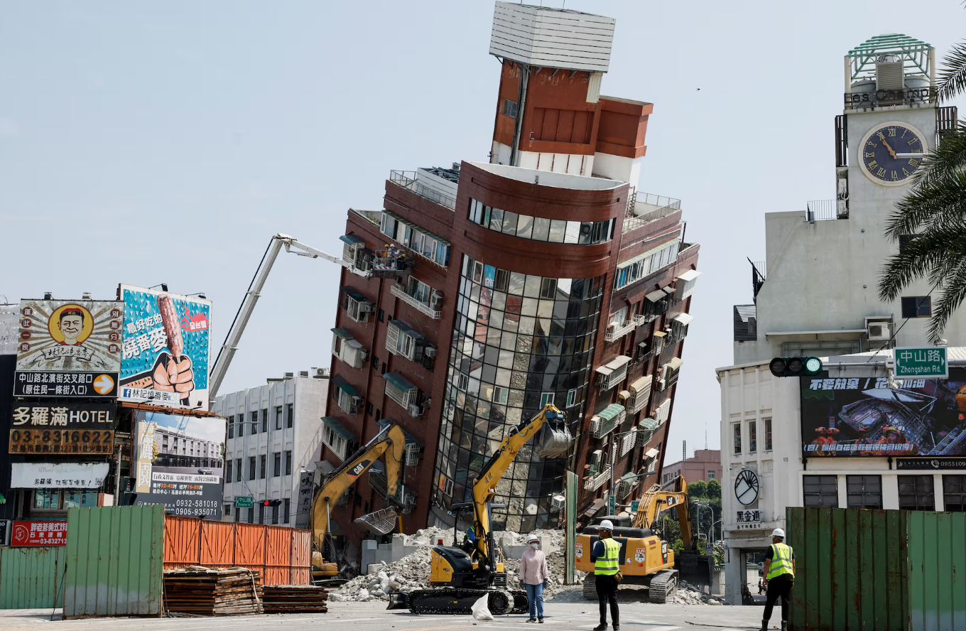 A general view as workers carry out operations while on an elevated platform of a firefighting truck at the site where a building collapsed, following the earthquake, in Hualien, Taiwan, April 4. REUTERS
