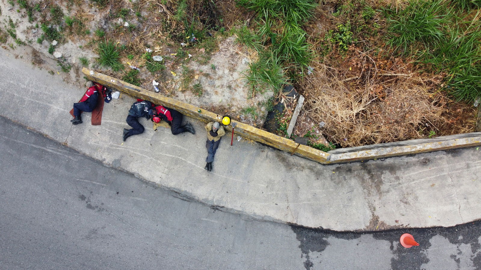 A drone view shows members of the Aragua state firefighters sleeping after fighting a forest fire in Henri Pittier National Park, in Maracay, Venezuela March 30, 2024. 