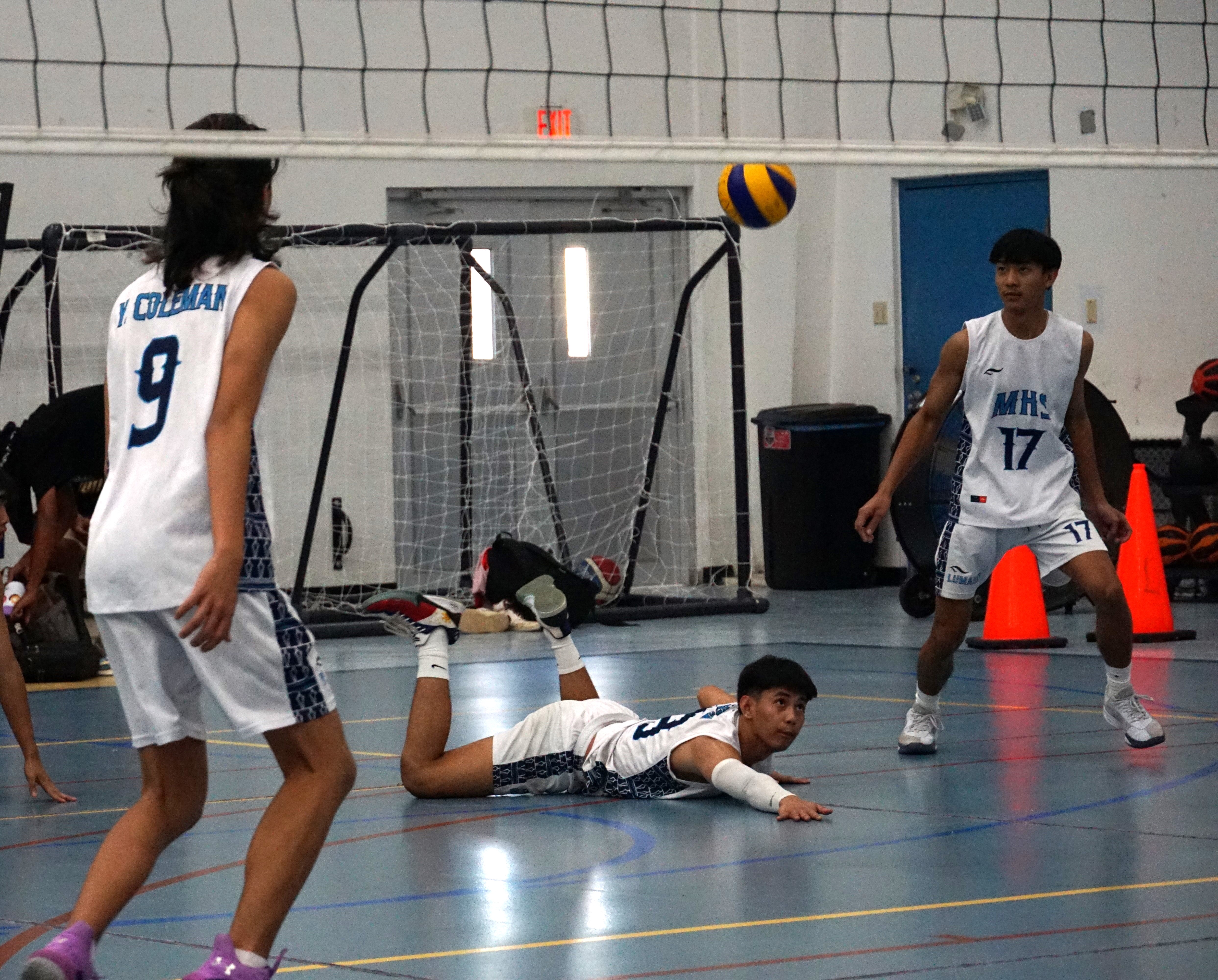 MHS' Jerome Manzon dives to save the possession during a game in the boys high school division of the NMIVA-PSS Interscholastic Volleyball League SY23-24 at the MHS gym on Friday.