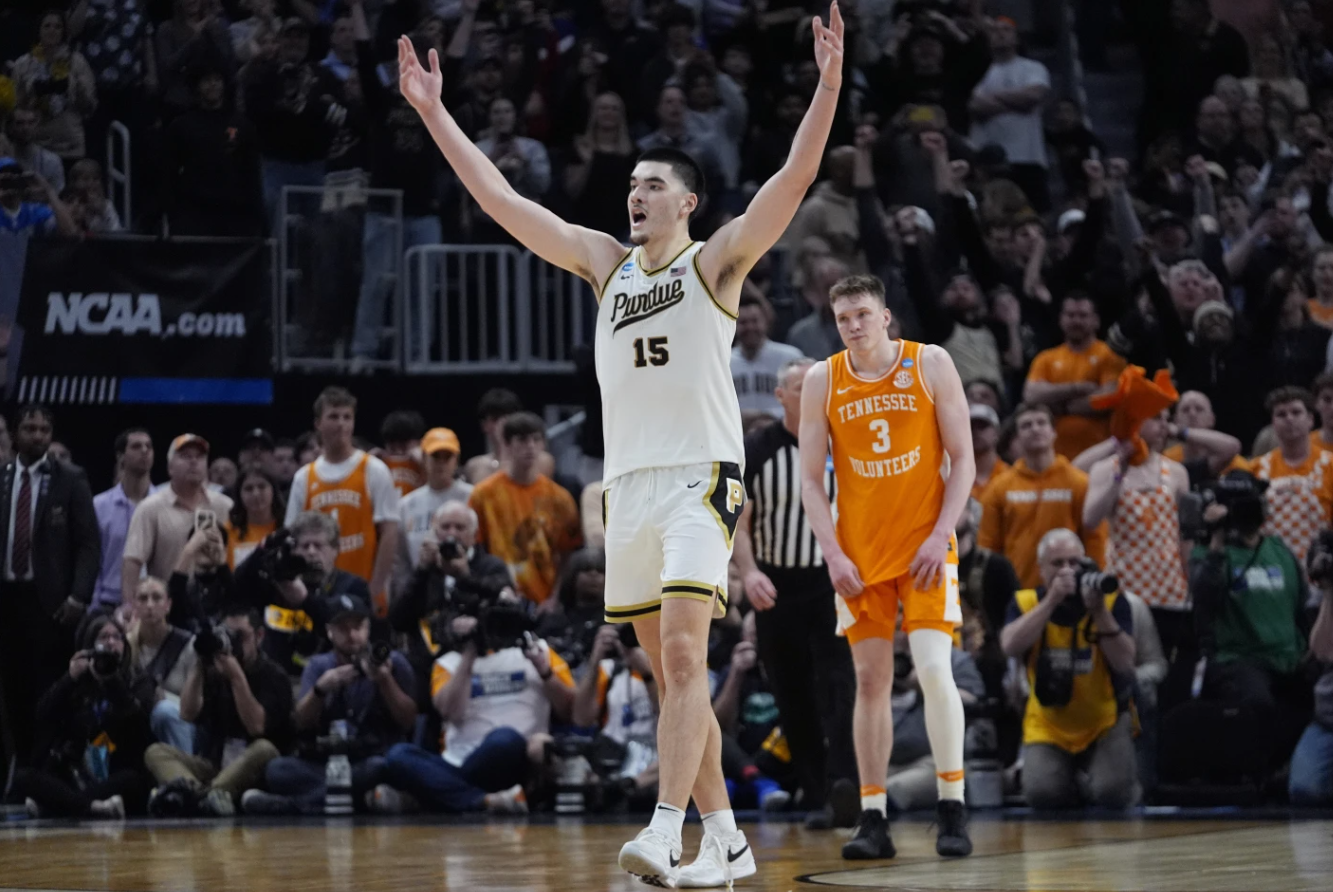 Purdue center Zach Edey reacts near Tennessee guard Dalton Knecht after Purdue defeated Tennessee in an Elite Eight college basketball game, Sunday, March 31, 2024 in Detroit.