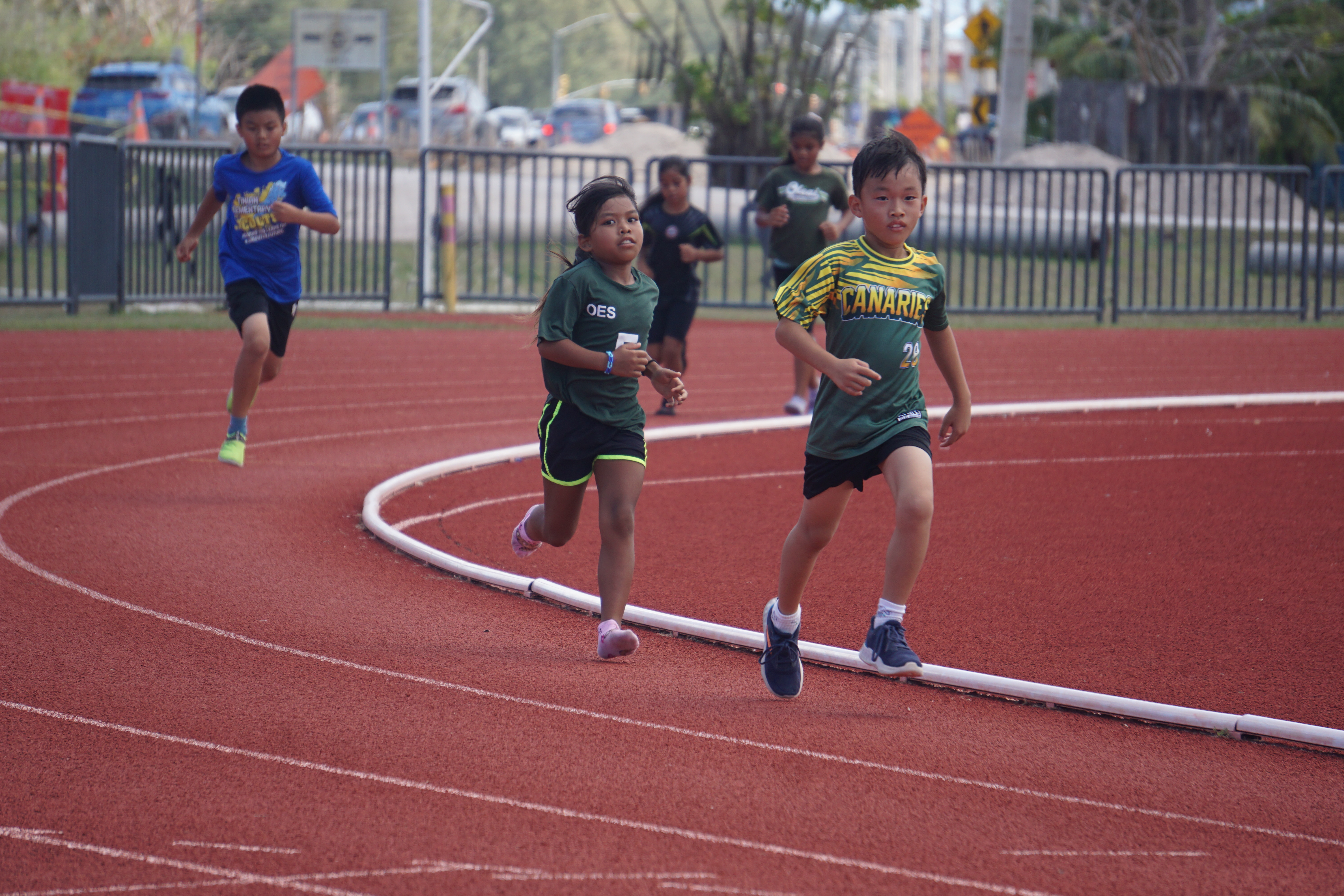 The U9 boys and girls take on the 1,500m event in the elementary school division of the PSS All School Track & Field (Athletics) SY23-24 at the Oleai Sports Complex on Saturday morning.