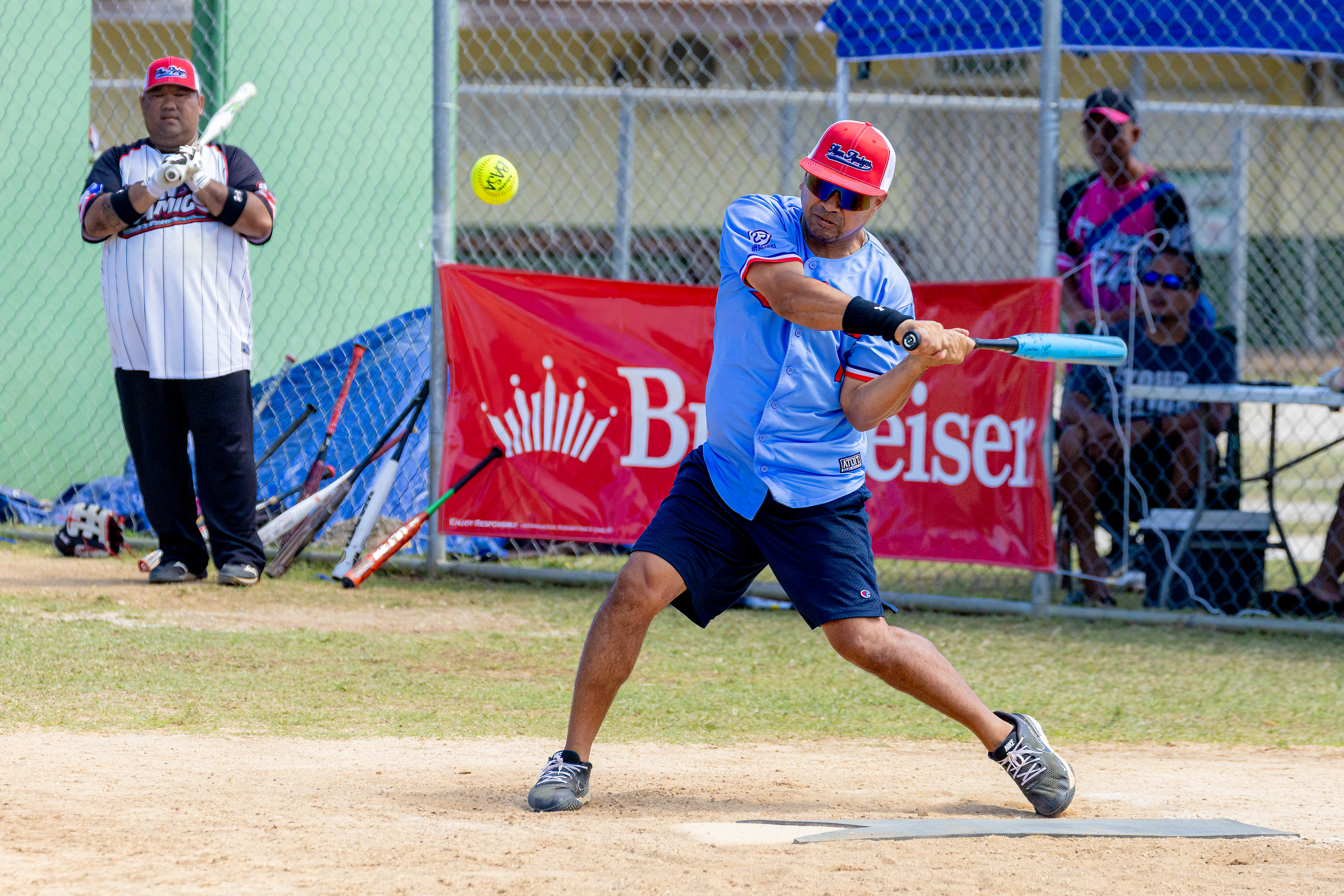 The Man Amigos' Eric Palacios connects a single during a masters division game of the 2024 Budweiser Belau Amateur Softball Association League at the Dandan baseball field on Sunday.