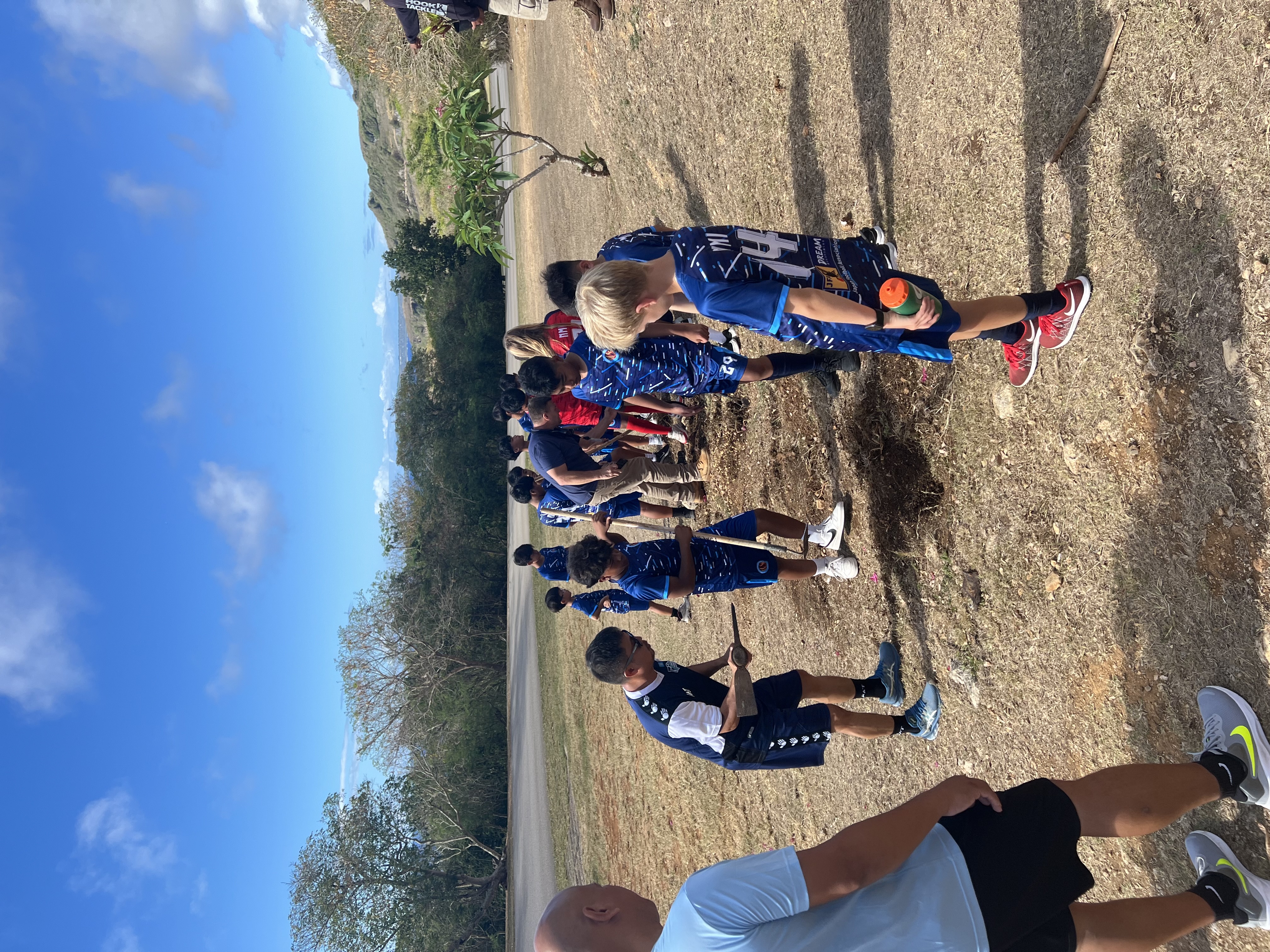 The CNMI Division of Forestry and the Marianas Visitors Authority facilitate an opportunity for young footballers of the Junior National Academy to plant flowers and trees in Marpi on March 28, 2024.
