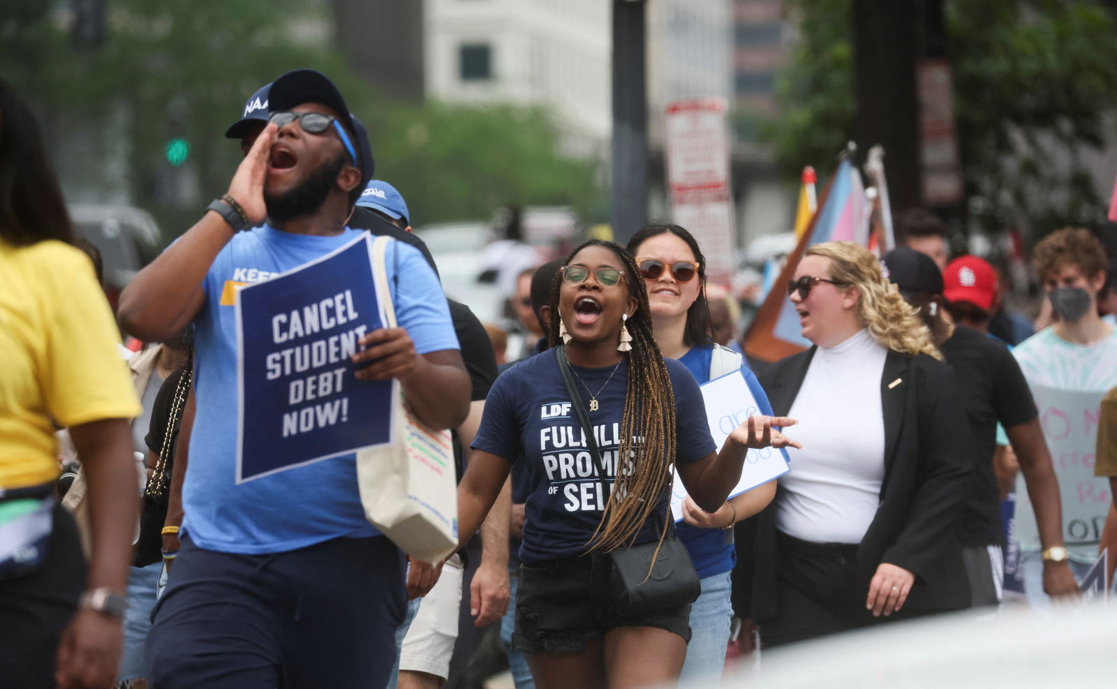 Supporters of U.S. President Joe Biden's s plans for student debt relief march near the White House after a U.S. Supreme Court decision blocking the president's plan to cancel $430 billion in student loan debt, in Washington, U.S. June 30, 2023. 