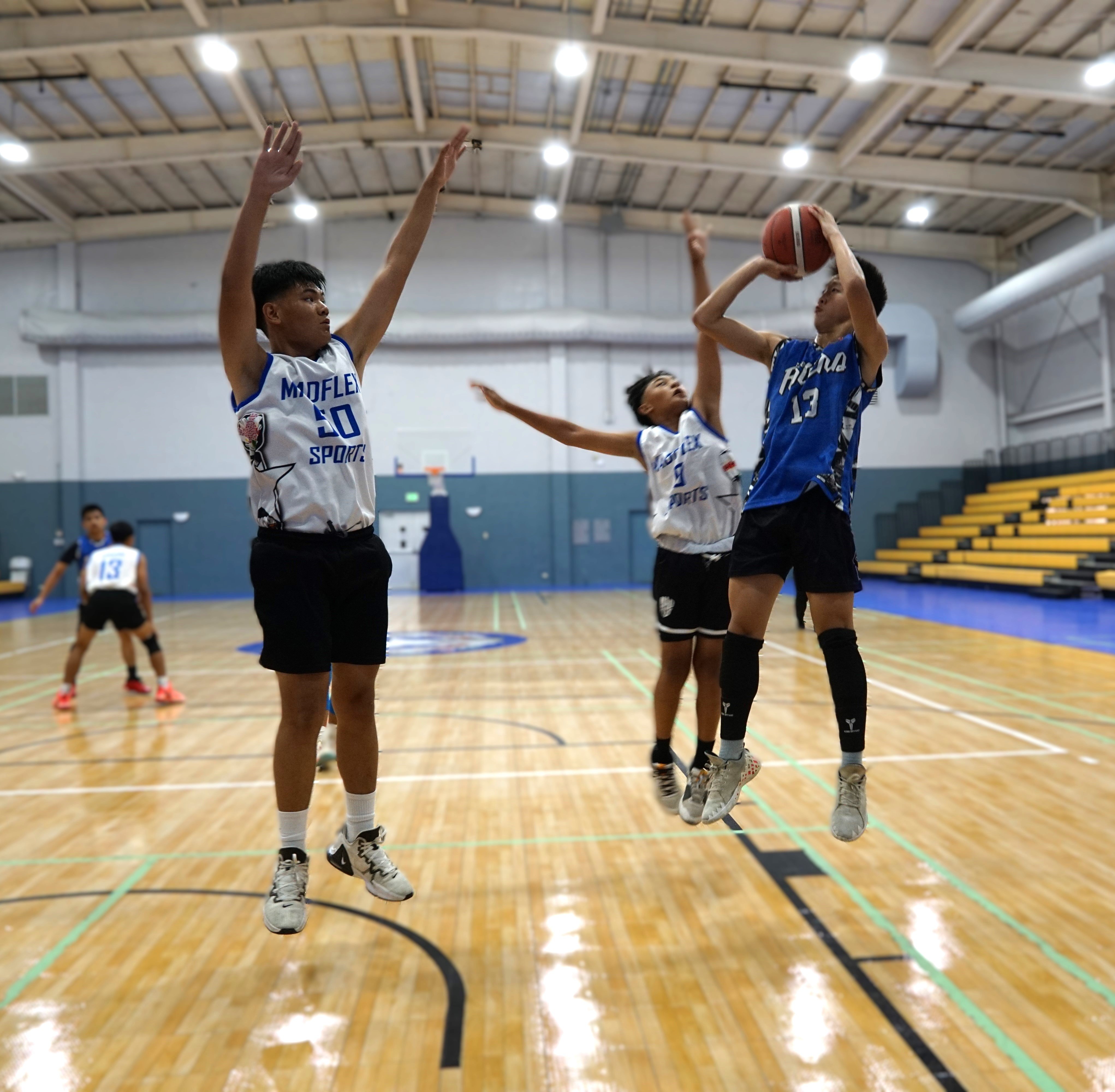 670 Rollers' Elijah Ye pulls up for the contested jumper during a Pokka Cup game against Madflex at the Gilbert C. Ada gym on Sunday.