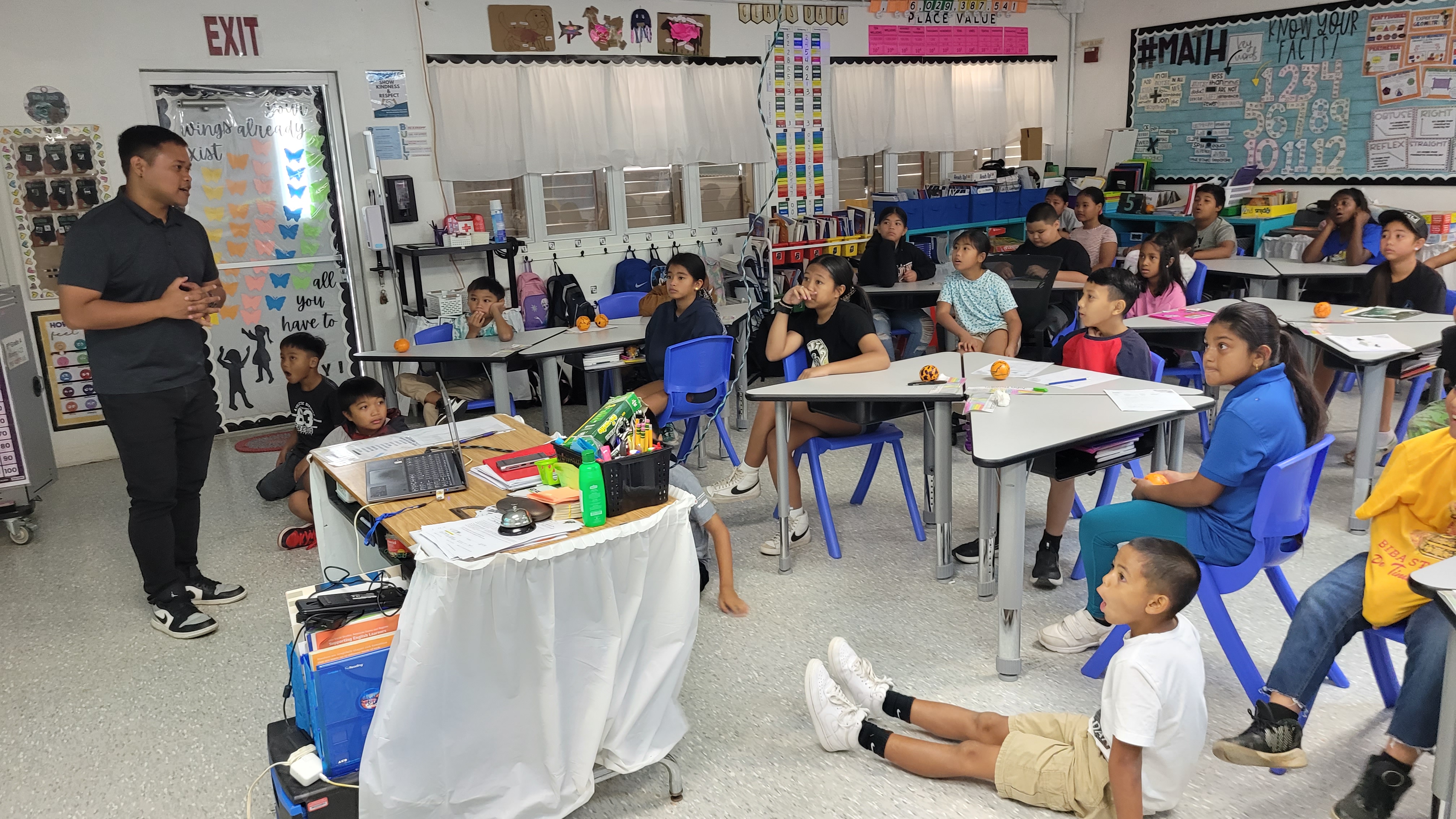 Fourth graders of Tinian Elementary School react to information about tourism presented by Marianas Visitors Authority Community Projects Specialist Jack Aranda on April 24, 2024. MVA and the Marianas Tourism Education Council conducted educational outreach at the school in Tinian.