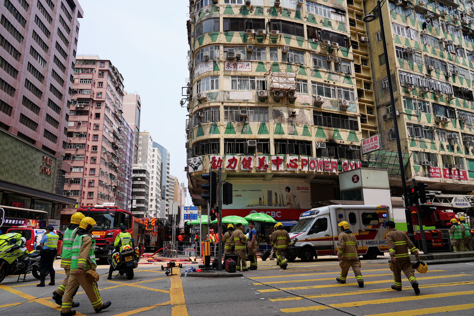 Firefighters work at the site where a fire broke out in a gym inside of a residential building, in the Kowloon district, in Hong Kong, China April 10, 2024. 