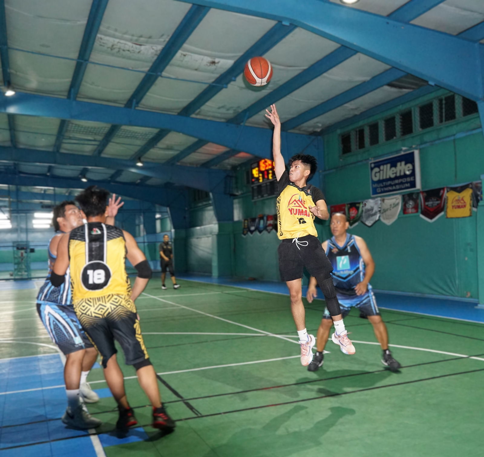 Yuman's Sean Licayan extends for the floater during a playoff game in season 2 of the Legends Sports Association Invitational Basketball League at the TSL Sports Complex on Sunday.
