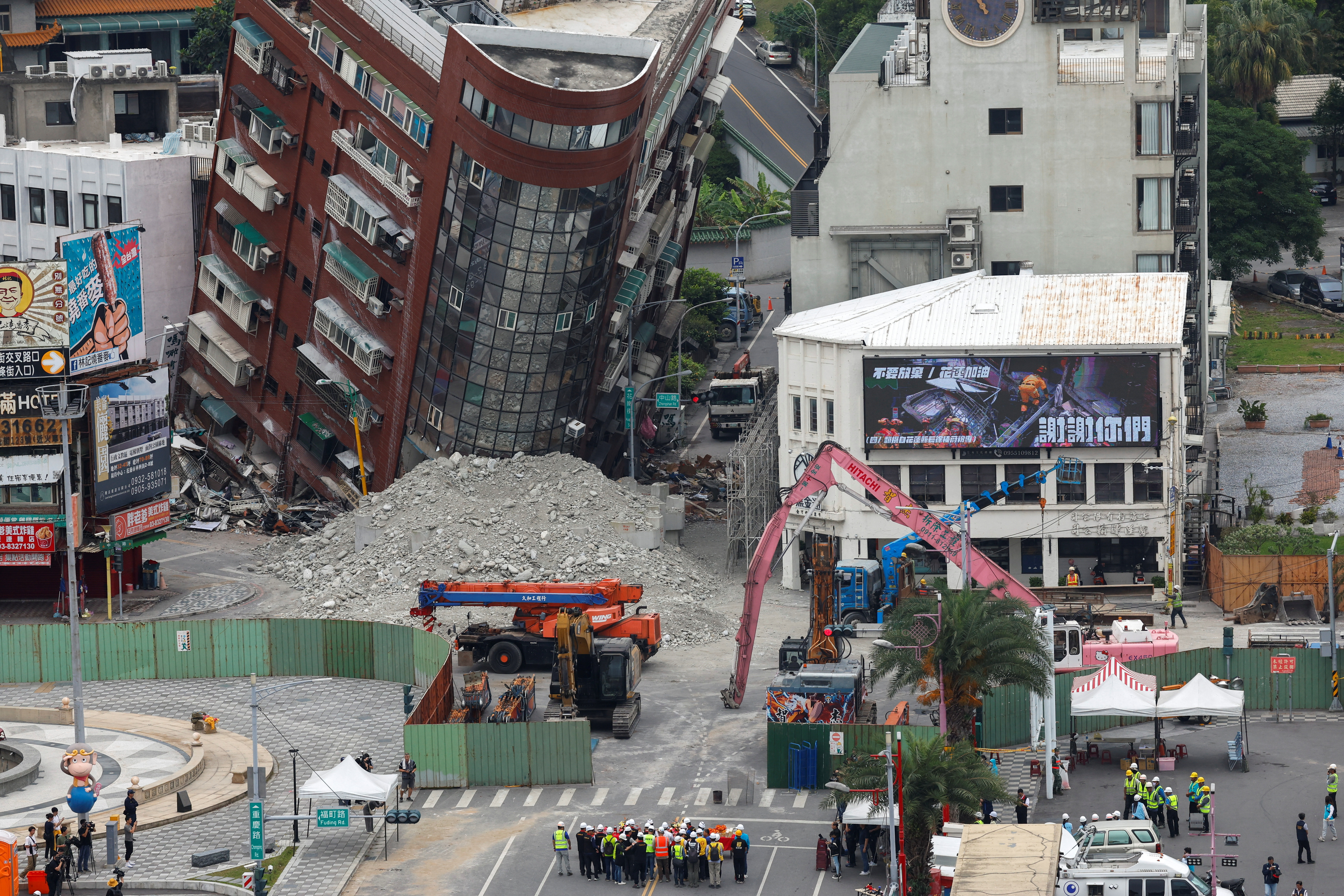 People take part in a ceremony ahead of the demolition of a damaged building, following the earthquake, in Hualien, Taiwan April 5, 2024. 
