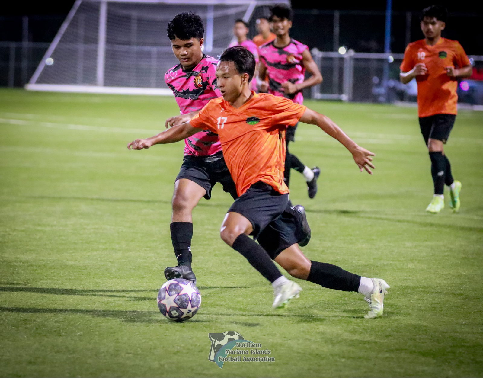 Kanoa FC's Ruben Guerrero attempts to dribble past a defender during a 2024 Marianas Soccer League 1 game at the NMI Soccer Training Center in Koblerville.
