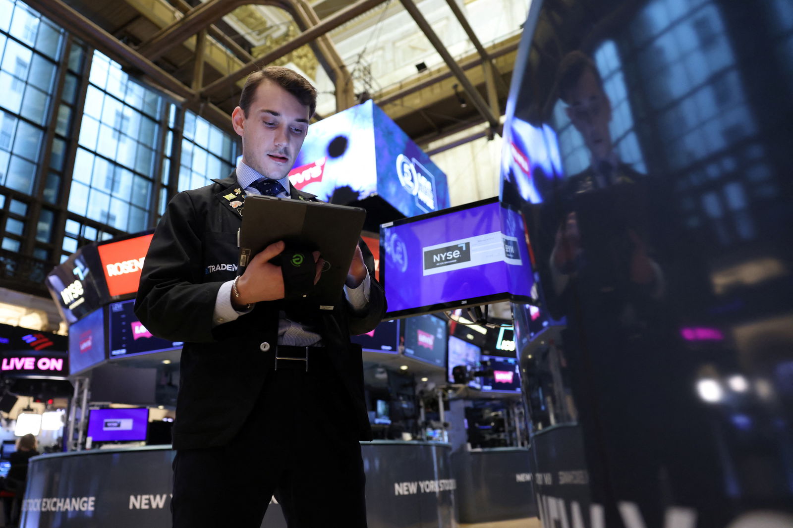 FILE PHOTO: A trader works on the trading floor at the New York Stock Exchange (NYSE) in New York City, U.S., April 5, 2024. 