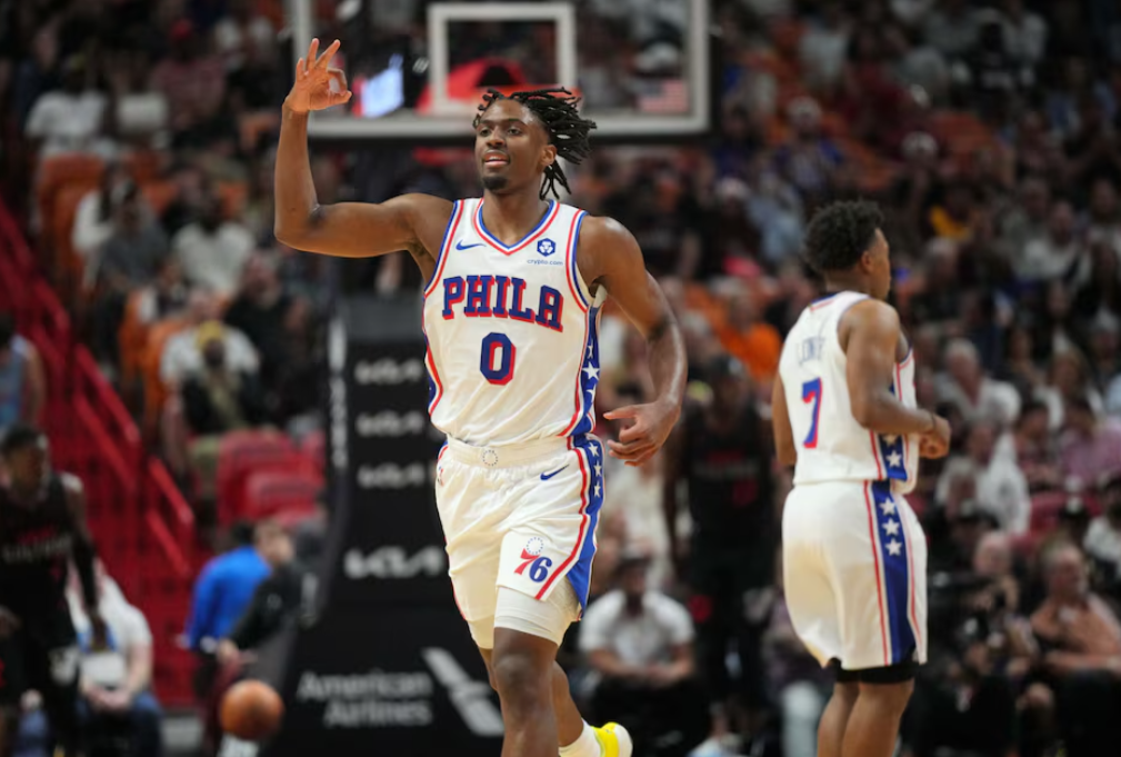 Philadelphia 76ers guard Tyrese Maxey (0) celebrates a three-point shot against the Miami Heat during the first half at Kaseya Center in Miami, Florida, April 4, 2024.
