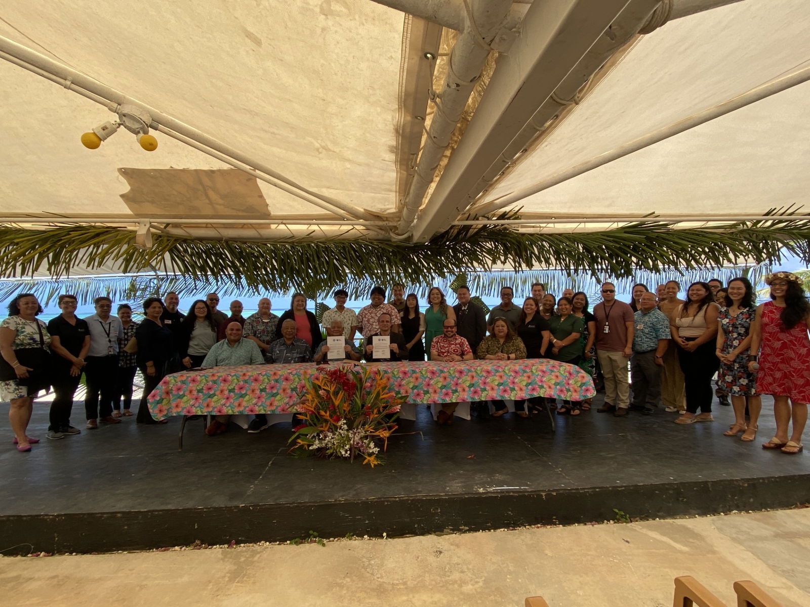 Gov. Arnold I. Palacios and Francois Rogers, executive director of the Blue Planet Alliance, display copies of the MOU they signed on Monday at Aqua Resort Club. Also in photo are Guam Lt. Gov. Josh Tenorio, CNMI Lt. Gov. David M. Apatang, other officials, and stakeholders.
