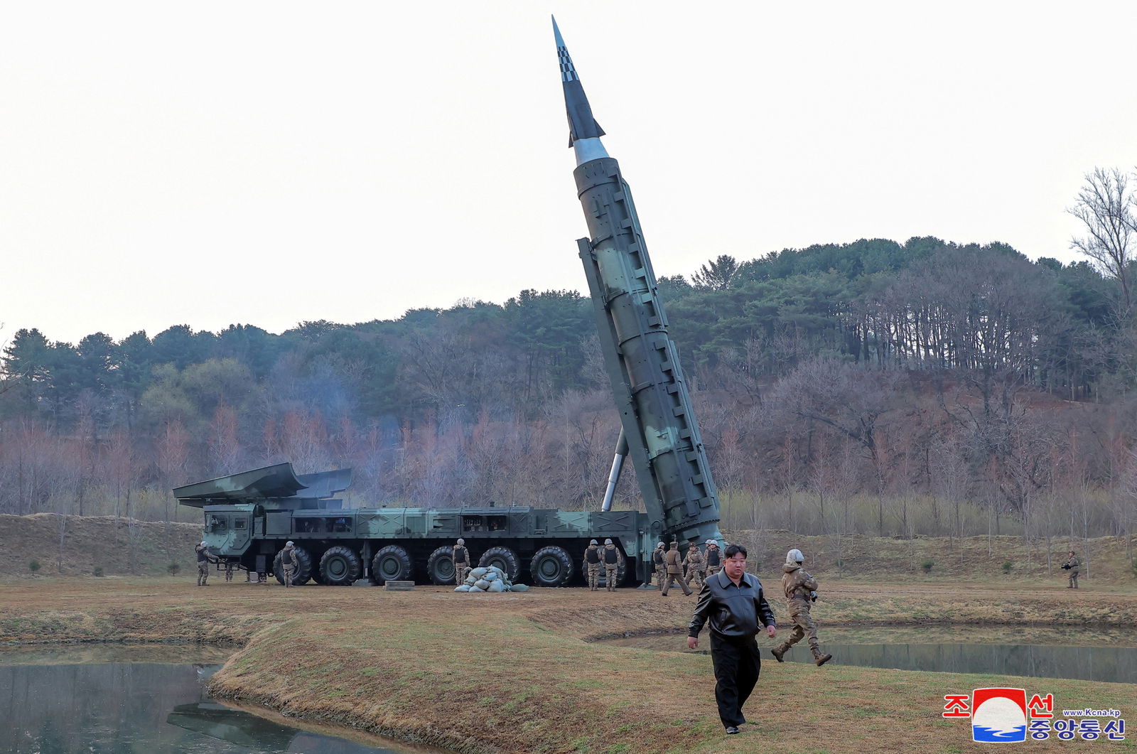 North Korean leader Kim Jong-un attends a test launch of a possible new mid- to long-range solid-fuel hypersonic missile, at an unknown location in North Korea, April 2, 2024, in this picture released on April 3, 2024, by the Korean Central News Agency. 