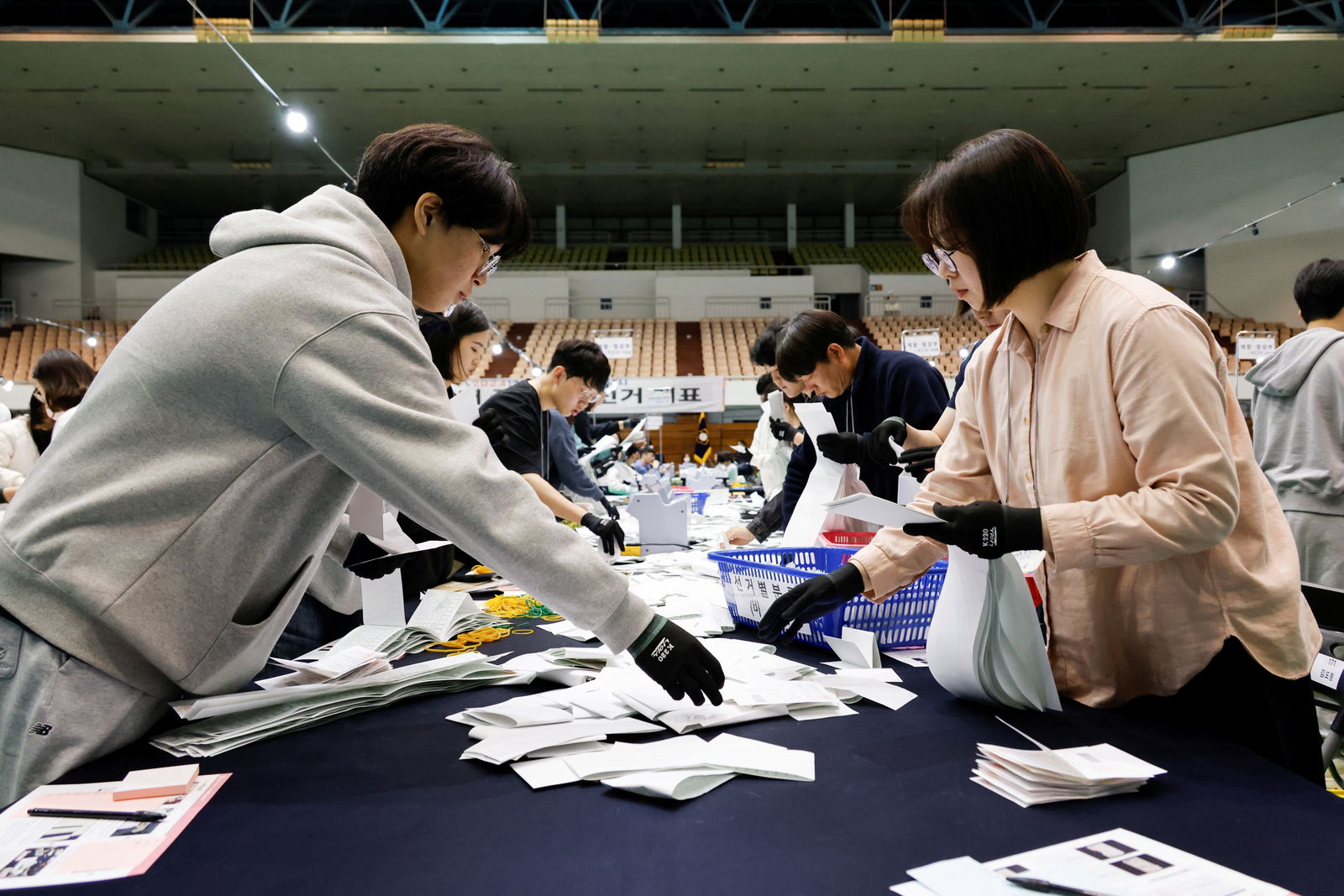 National Election Commission officials count ballots during the 22nd parliamentary election in Seoul, South Korea, April 10, 2024. 