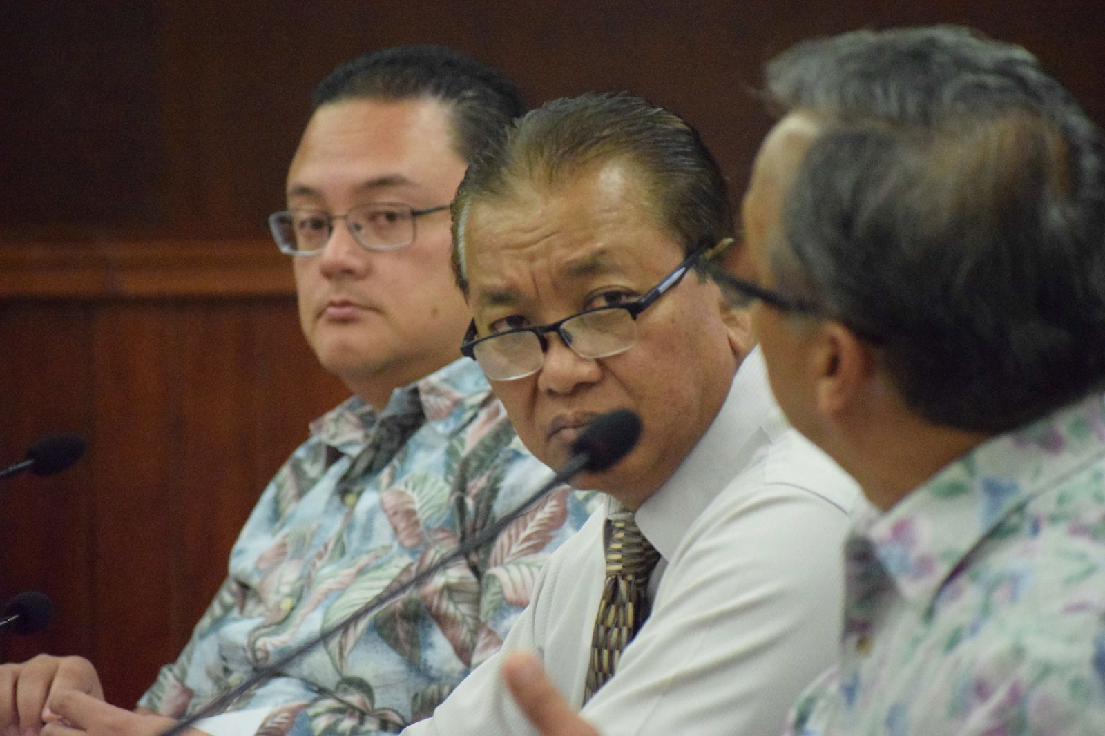 Sen. Frank Q. Cruz, center, and Senate Vice President Donald Manglona, left, listen to Sen. Paul A. Manglona.